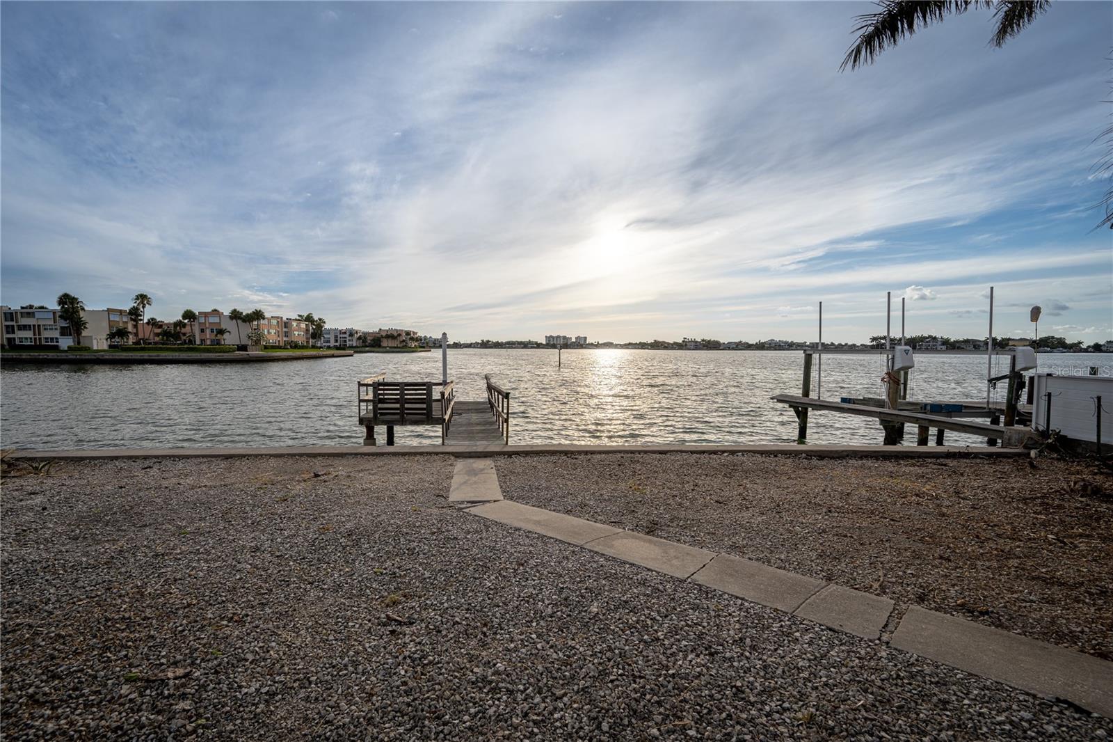"Location, location, location!"—the golden rule of real estate, and this home delivers in every way. Nestled on the open waters of Boca Ciega Bay, this 2-bedroom, 2-bathroom gem is your front-row seat to stunning Gulf sunsets every evening. Imagine unwinding in your backyard with your favorite drink as the sky transforms into a masterpiece of colors.

The possibilities here are endless. With a generously sized backyard, there's room to add a pool or expand the existing deep-water dock to suit your boating dreams. Plus, the home itself offers ample opportunity for expansion, allowing you to create the waterfront retreat you've always envisioned.

Convenience meets paradise in this location. You're just minutes from vibrant stores, fantastic restaurants, and world-class beaches. Need to travel? Tampa International Airport is only 30-45 minutes away, and Downtown St. Pete is a quick 20-minute drive.

Don't miss your chance to embrace the waterfront lifestyle and make this home your own slice of paradise. Schedule your private tour today and start imagining the possibilities!