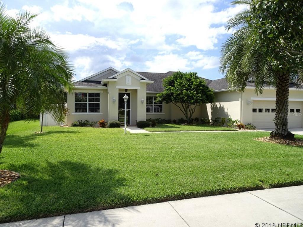 Completely upgraded home in the Sugar Mill Gardens area of the Sugar Mill Country Club Community.  Kitchen is fantastic with beautiful wood cabinets, granite countertops, and upgraded stainless appliances.  Tile and high end laminate wood flooring throughout entire home.  Bathrooms have been updated with the same wood cabinets in the kitchen.  Bonus room being used as an office or could be a den.  Large screened porch with area that would be perfect for a hot tub.  Well maintained lawn and shrubs.  Windows have verticals and also screened shades to reduce energy costs.  This home is ready for immediate move-in! ;Water: City