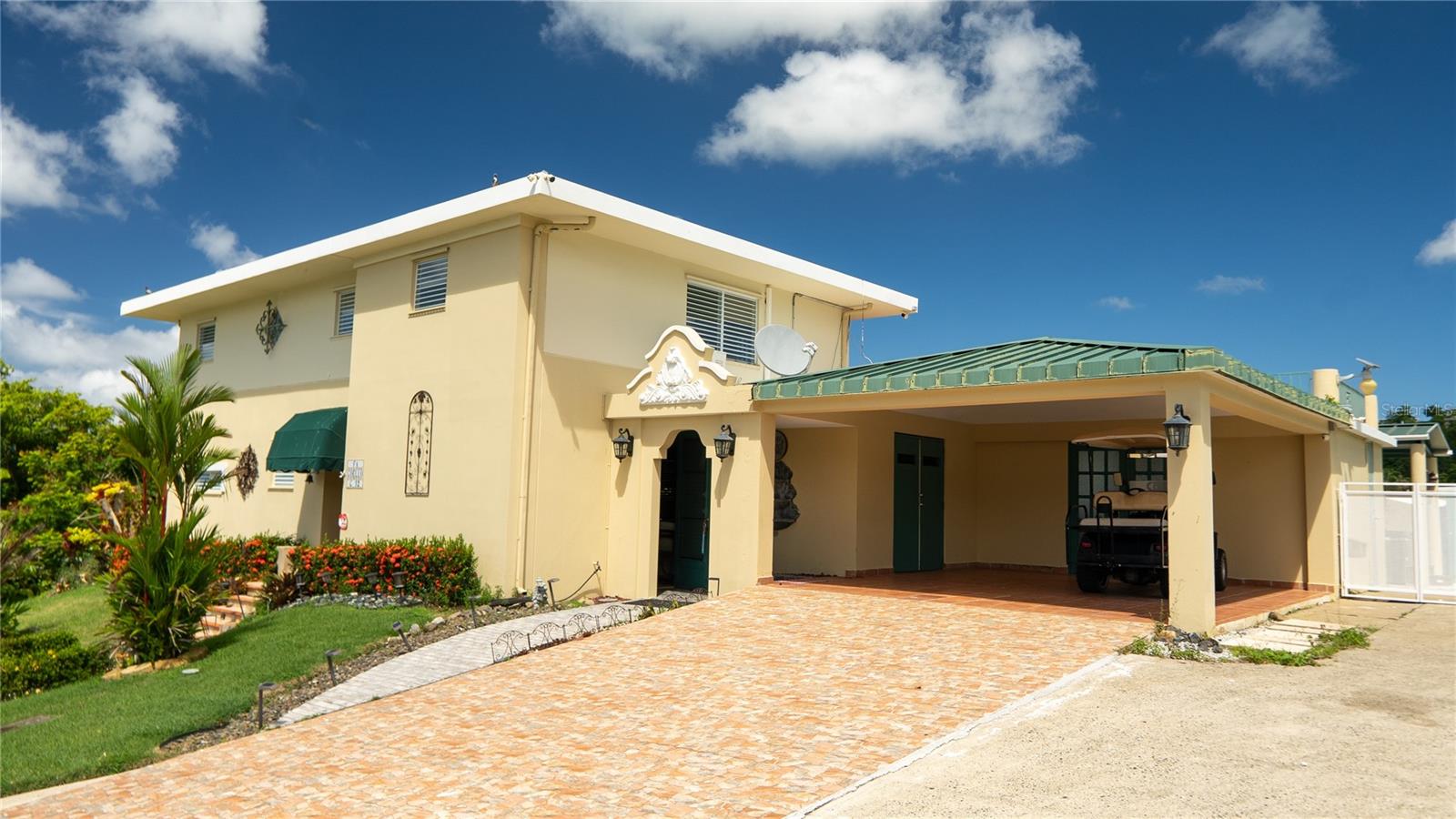 Discover this exceptional residence in the Hacienda Margarita community, just minutes from Luquillo's world renowned beaches.
Situated on an expansive 3,100-square-meter lot (approximately 0.77 acres), this thoughtfully designed home features 4 bedrooms and 3.5 bathrooms, including three bedrooms on the second level and a private first floor bedroom with a full bathroom, ideal as a guest suite, in-law quarters, home office, or studio. Designed for both comfort and entertaining, the property offers three spacious terraces, a private swimming pool, and a jacuzzi, creating the perfect setting to enjoy Puerto Rico's tropical lifestyle. Additional features include a full house backup generator, water cistern, extended carport, three storage rooms, electric storm shutters, and generous indoor and outdoor living areas designed for functionality and everyday comfort. Residents of Hacienda Margarita enjoy outstanding community amenities, including a clubhouse, swimming pool, two tennis courts, basketball court, and playground, all within a well established residential community.
Whether you're looking for a primary residence, a vacation retreat, or an investment opportunity, this home offers an exceptional combination of space, privacy, convenience, and coastal living.