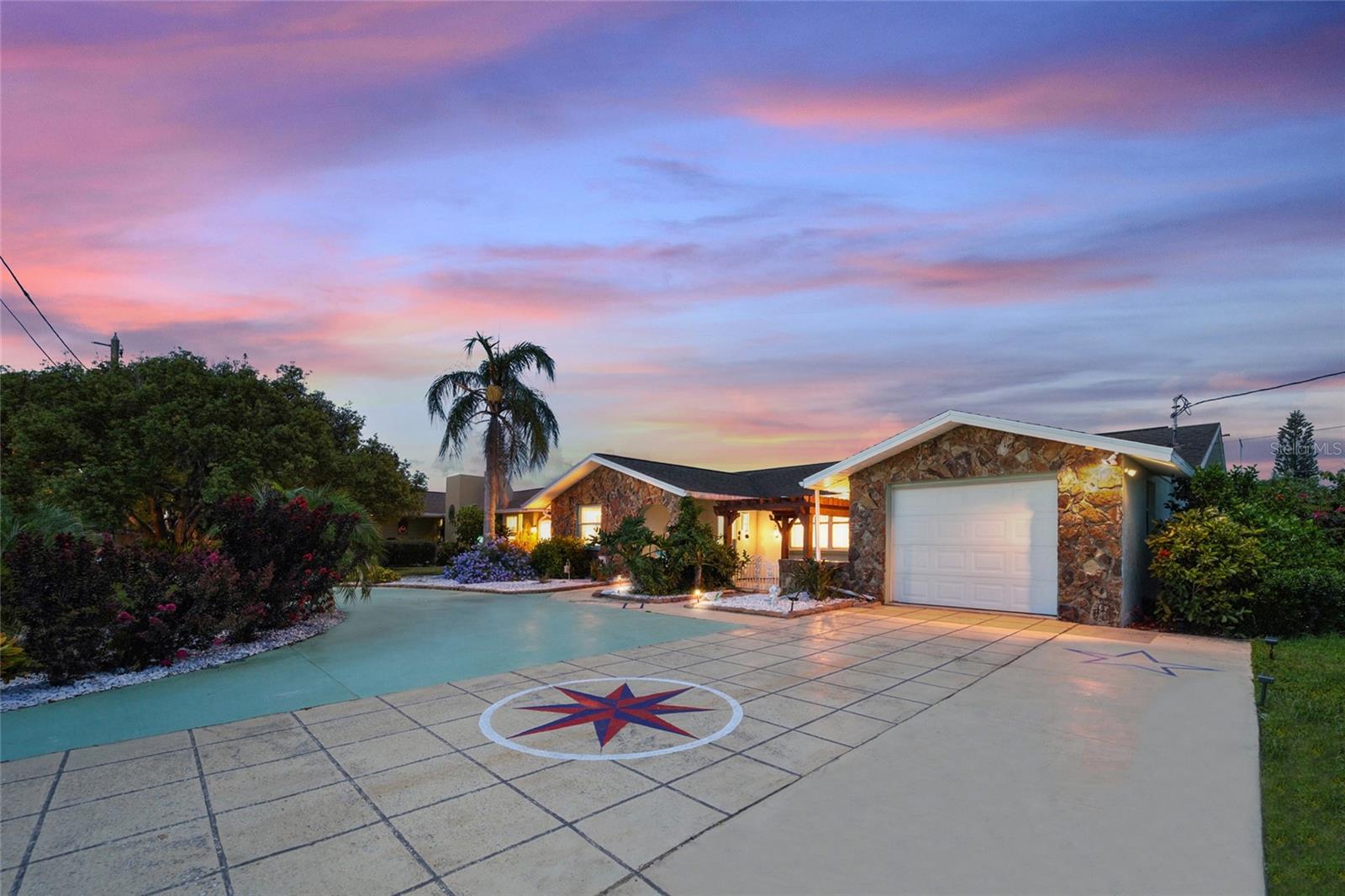 8542 Betty St in Port Richey, where your backyard serves as the gateway to the Gulf. This exceptional property features a private dock situated on a deep canal, providing effortless, direct Gulf access for boaters and outdoor enthusiasts. Out front, a convenient circular driveway offers excellent curb appeal and plenty of parking for family and guests. Inside, the heart of the home boasts a beautifully refurbished kitchen equipped to handle everything from quick weeknight meals to coastal entertaining. The interior also features a large, luxurious jacuzzi tub that stays with the property for your ultimate relaxation. Complete with a versatile freestanding storage shed in the yard, this home perfectly combines functional layout with the ultimate Florida waterfront lifestyle.
