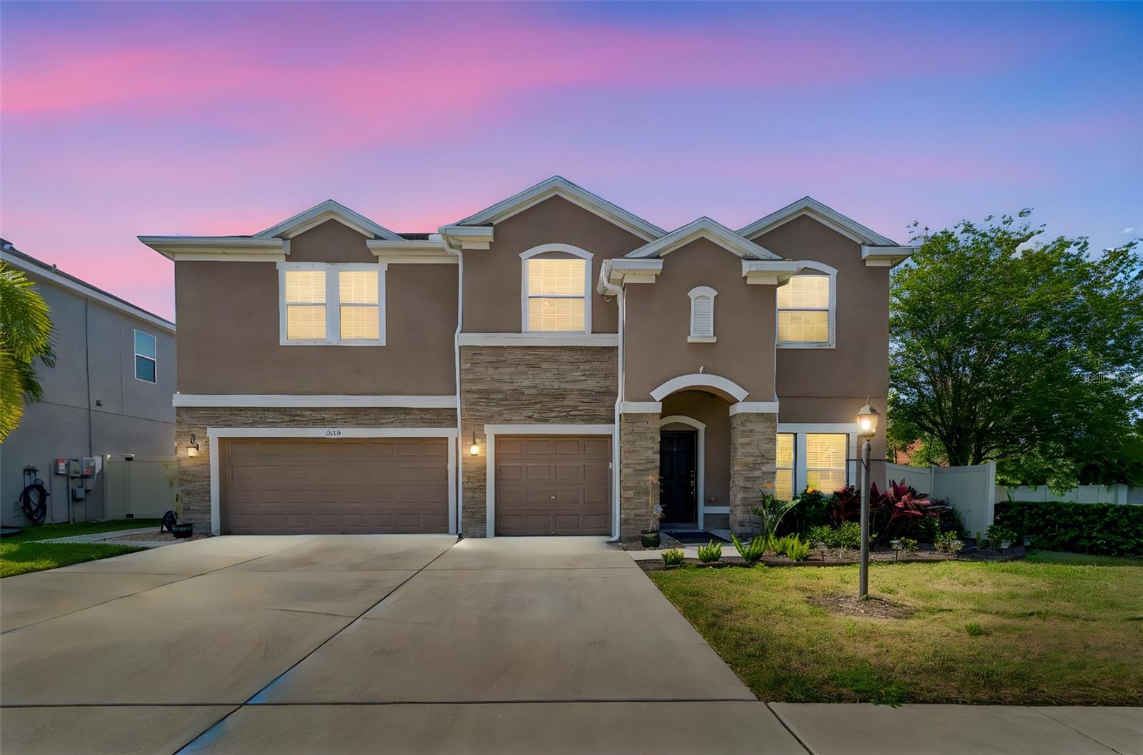 One or more photo(s) has been virtually staged. Welcome to Bayou Cove, a rare opportunity to own newer construction in the heart of Pinellas County. This exclusive enclave of just 22 homes, built by Ryland Homes, is ideally located directly across from the Bayou Club, offering a more private feel while still being close to everything. This light and bright two-story pool home offers 5 bedrooms, 3.5 bathrooms, and a 3-car garage, and is perfectly positioned next to a landscaped pond. Built more recently than most homes in the area, it combines modern design, efficiency, and functionality, featuring a nearly 20kW solar panel system that is fully paid off and designed to offset most energy usage, along with a whole house water filtration system and water softener. Inside, the open layout is filled with natural light, featuring a spacious great room and a first-floor primary suite with tray ceilings. The primary bath includes dual sinks, granite countertops, a garden tub, separate shower, and a large walk-in closet. The kitchen is designed for everyday living and entertaining, offering granite countertops, 42-inch wood cabinetry, a breakfast bar, closet pantry, and abundant prep space. Upstairs, a large bonus or loft area provides flexible space for a media room, office, or playroom, with additional bedrooms and a Jack and Jill bath. Step outside to your private backyard retreat featuring a saltwater pool with spa and propane heater, a fire pit, and plenty of space to relax or entertain. Additional highlights include a 2022 AC system and a spacious 3-car garage. Homes offering this combination of newer construction, energy efficiency, pool, and proximity to the Bayou Club are hard to find. Don’t miss your opportunity.