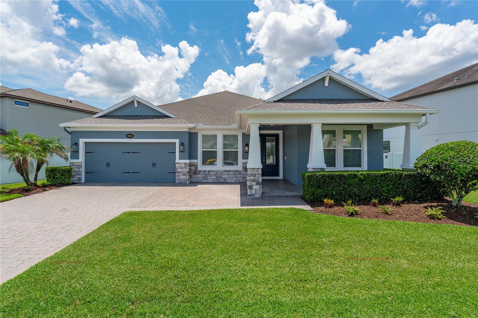 Welcome to this stunning 2536 sq. ft. home featuring 4 bedrooms, 3 full baths, and a large primary suite featuring a tray ceiling, walk in closet , large shower and dual sinks .Enjoy a dedicated media room complete with a Sony projector, screen ,built in speakers and sound system.
The gourmet kitchen boasts 42" cabinets with under cabinet lighting while the lower cabinets feature pull - shelving. Granite countertops, large island, eating space in kitchen and a oversized pantry with wood shelves. 

Neutral gray flooring, neutral walls,  high ceilings, inside laundry with sink and 42" cabinets also houses the Future Home Integration smart home network rack which conveys with the property.
Surround sound in the kitchen, dining room, living room and primary bedroom, motorized window and door shades, alarm system ( can be monitored) add comfort and convenience. 
Energy efficiency is a stand out feature with a fully owned solar system with battery back up, - providing peace of mind during Florida storms and power outages. Whole house water filtration, water softener, epoxy garage floor and tall built in cabinets, transferable termite protection and low electric bills make this home as efficient as it is beautiful.

Relax in the private, vinyl fenced backyard over looking wooded conservation with no rear neighbors. The paver driveway accommodates two additional vehicles, exterior security and programmable holiday lighting and mature landscaping add curb appeal.

Located in a desirable 24 hour monitored gated community in Meadow Woods, residents enjoy a low HOA that includes Internet ,community pool, playground and dog walking areas. Located just minutes from Lake Nona, Medical City, Orlando International airport, shopping, dining and major highways ,this remarkable home offers the perfect blend of luxury, efficiency, technology and location. This is Florida living at its finest - schedule your private showing today!