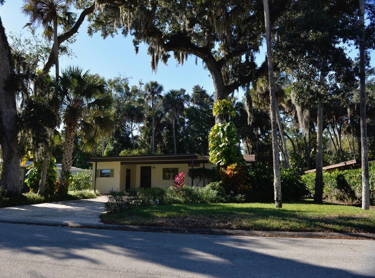 This gorgeous 2 bedroom, 2 bath home is a slice of tropical paradise. You feel it as soon as you walk in. Presenting nicely with new HVAC, new duct work, and updated appliances. Roof is less than 5 years old. Both bathrooms have been updated to include new sinks, new water closets, and fresh new wall coverings. A beautiful and large enclosed Florida Room really showcases the natural greenery around the property. The yard has a wood deck and sprinkler system as well.  The location of this property also has the convenience factor, as the walkway to the Heated Pool and Tennis Courts are nearby. Additionally, the boat launch is located on the same street. Edgewater Landing is an award winning ACTIVE COMMUNITY. Bonuses include that you may store a boat or RV (when there is room) at no charge. The HOA includes Spectrum cable, Wifi, and Internet. Amenities also include a fitness room, pool tables, screened in hot tub, access to the Intracoastal fishing pier, dance floor, bingo, and ceramics classes. Live where you play. ;Water: City