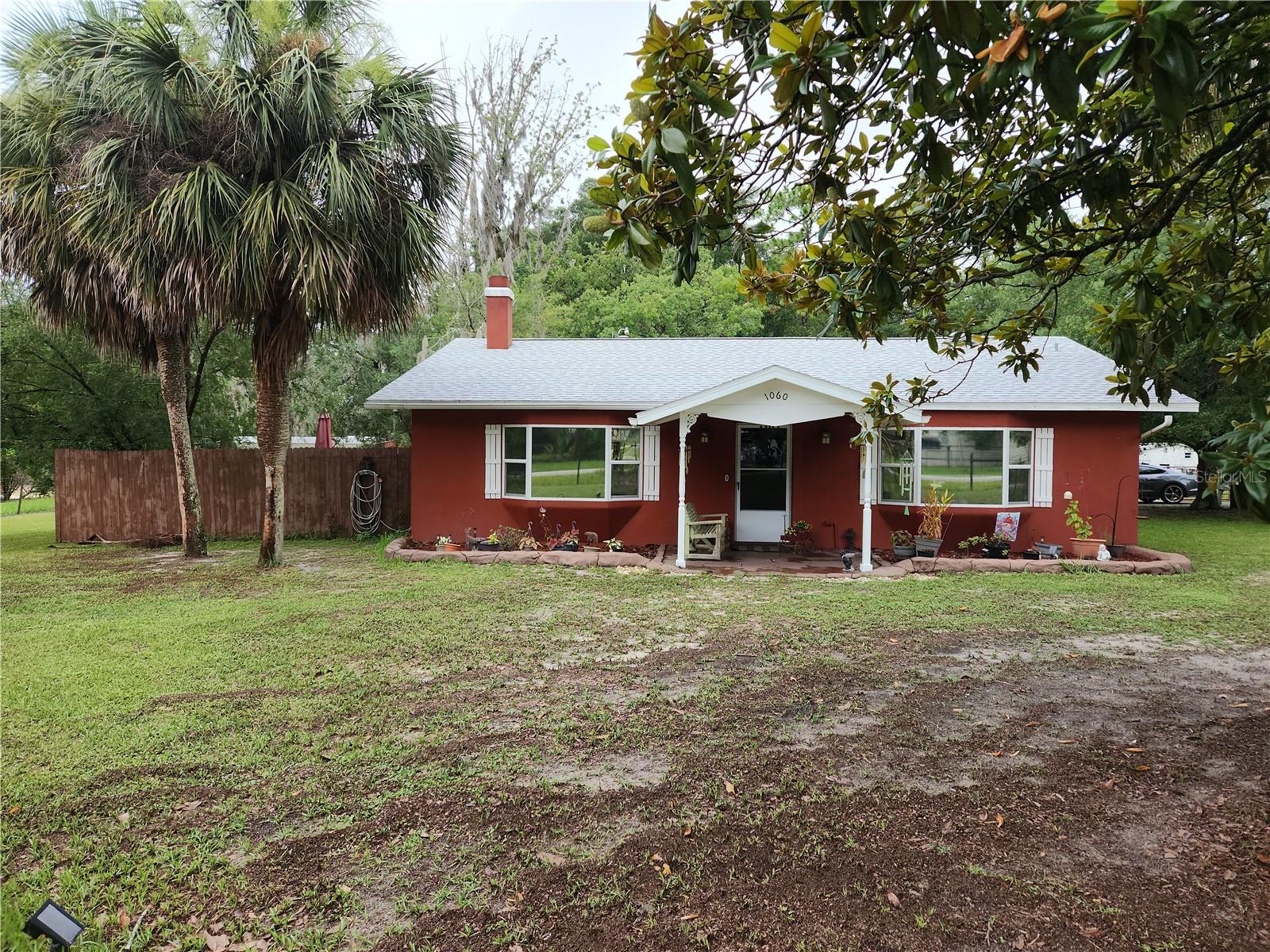 Welcome to this beautiful home in Ocala Estates located just minutes from the new World Equestrian Center. This home is centrally located close to State Road 40, I75, and Dunnellon. Ocala International Airport is just seven miles away! The home features 3 bedrooms, 2 bathrooms, a Fireplace, a Florida room, 2 car garage, and a mother-in-law-suite with a full kitchen. It has a new Roof, Well, and Water Heater. This property sits on .70 acres on a corner lot, the property is completely fenced. The home is 18 miles from the crystal-clear Rainbow River. This is a significant draw for individuals who enjoy water activities and outdoor recreation. Call today to set up your private showing.