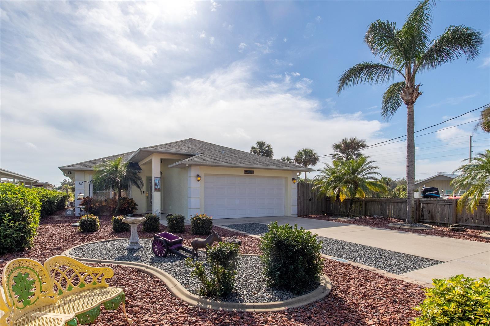 Enjoy the Manatees and Wildlife from the comforts of your own dock. Come see this amazing, waterfront home in Oak Hill as it will not last long. This home has everything you need for River Life and more. Built in 2007 on a wide canal just minutes from the 
Indian River, step off your 10,000 pound boat lift, dock and patio into a main house 3 Bedroom/2 Bath with vaulted ceilings.
Many custom features such as stone fireplace, open kitchen with stainless appliances, Corian countertops and
a beautiful custom backsplash. Large bedrooms with ceiling fans, double sink and a large walk-in closet. The large
screened porch has amazing waterfront views as well as another large outdoor deck ready for sun and entertaining.
Stay prepared with a built-in whole house propane generator. New Air conditioner and new electric are just some of
the more recent improvements. Great landscaping and cute walkways lead you around the home leading you to the amazing
waterfront. If that were not enough, this home also has a large 1/1 In-Law suite for your family, guests or rental income! ;Water: City