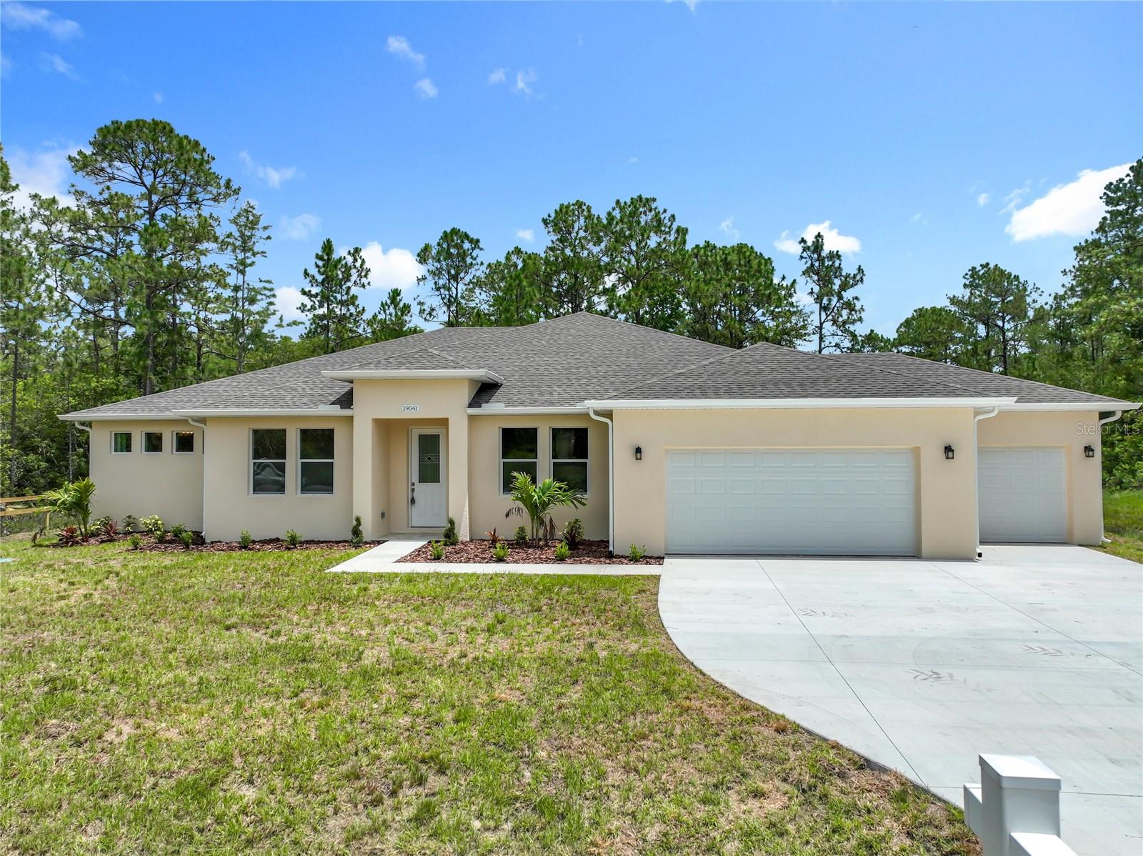 New construction in Cape Orlando Estates (Wedgefield). 4 bedrooms and 3 bathrooms in this newly built home. Porcelain flooring throughout, granite countertops in kitchen and bathrooms. All stainless steel appliances, 3-car garage. Large open-concept kitchen and living area. This house is a great combination of rural living with luxury finishes.