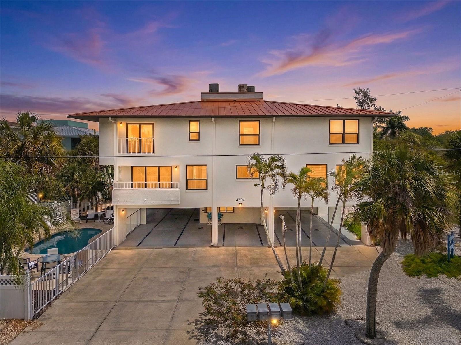 Gulf View Town Houses Condominium is one of a few select small association properties nestled just south of Manatee Public Beach.  Just far enough away for a quiet beach day and just close enough to be an attractive location for vacation renters.  A convenient grocery store and shopping district are just 1/8 mile east of this Holmes Beach condominium, making errands a breeze. The Association has been diligent and timely with their maintenance and repairs of the building and common elements, which are in tip top shape. Beach access is a short 150-yard walk west, offering the public beach restaurant and tiki bar just a short stroll north. This is one of the premier weekly rental locations in Holmes Beach and Anna Maria Island as a whole. Unit #1 has two designated parking spaces, a small first floor storage shed, and is one of just four units in this intimate single building condominium complex with heated pool on a spacious corner lot.  West facing, with tons of light, this spacious two story 2 bed 2.5 bath condominium is the ultimate in hassle free island living for both owners and renters.  On the first floor you will find tile floors throughout an open floor plan with an all-wood cabinet galley kitchen with induction cook top/range and hood, nice breakfast nook, and large living room with ½ bath.  The kitchen also features full matching stainless GE Profile line appliances in great shape. A 5x12 ft balcony just off the living room is perfect for sunset viewing and windows and doors are hurricane rated and have been replaced in the past few years. Upstairs find the Primary en-suite bedroom with private west facing balcony and full tile bath with whirlpool tub and separate shower.  The guest bedroom is also roomy with private full tile shower bathroom.  The laundry room with washer and dryer are also found on the second floor.  Definitely schedule a showing to take a closer look!  Thanks *A FEW PHOTOS ARE VIRTUALLY STAGED*