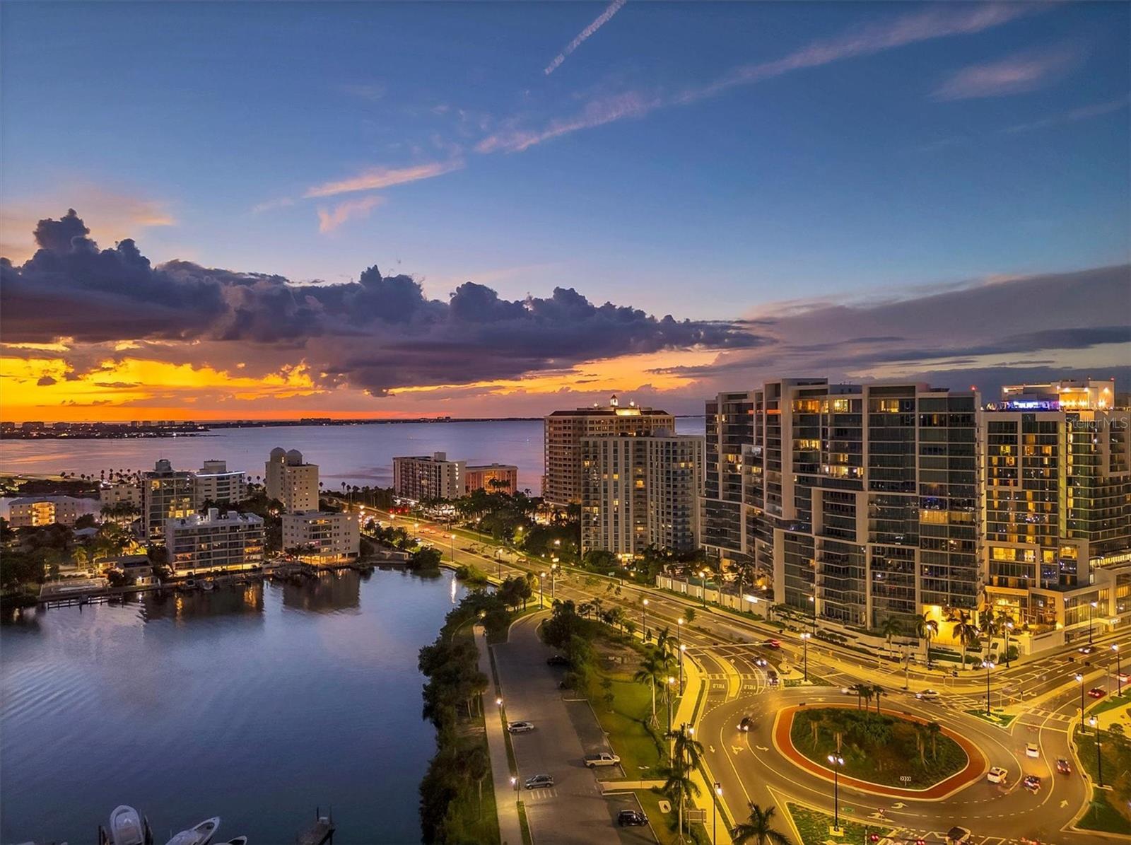 The contemporary design of VUE Sarasota Bay creates the ideal address for year-round or seasonal waterfront living. Each unit provides an extraordinary waterfront lifestyle of breathtaking vistas of Sarasota Bay, Marina Jack, Big Pass and the Gulf of Mexico! Iconic architecture designed by the internationally recognized architecture and planning firm Nichols Brosh Wurst Wolfe & Associates Inc. highlights floor-to-ceiling glass walls, free-flowing rooms and spacious terraces that create a seamless integration of interior and exterior living. Residence #1606 has two bedrooms, three baths, a large den, an expansive laundry room, a climate-controlled storage unit and two assigned parking spaces. As the private access-controlled elevator opens to your private residence entry foyer, you will be greeted immediately by custom craftsmanship details throughout and spacious interiors that are dominated by breathtaking views. Venetian plaster decorates the walls and beautifully reflects the outside light and seascape of Marina Jack. This unit enjoys 10-foot, full-height sliding glass doors and windows. Enjoy smart home capabilities including motorized shades, lighting controls on your phone and audio controls in the main living room. The gourmet kitchen is adorned with coffered ceilings and a complete JennAir stainless Euro-style appliance collection including 42-inch built-in refrigerator, 36-inch electric cooktop with 36-inch stainless steel canopy hood, 30-inch built-in microwave and convection double oven, and dishwasher. As for the building itself, rest assured your safety and convenience are priorities at Vue Sarasota Bay. Residents enjoy 7,000 square feet of extraordinary interior amenities including a state-of-the-art fitness center, well-appointed formal lounge, large club room, daily coffee station, club bar, catering kitchen for special events, business center, management offices, resident board room, valet station and concierge desk. With 24-hour security, select concierge services and valet parking available from 7 a.m.-11 p.m. daily, you'll have peace of mind knowing every aspect of your comfort is taken care of. The beautiful pool deck overlooks Marina Jack and is the place to relax or catch up with friends. You can expect to enjoy a heated pool, spa, several private seating areas with fire pits and multiple gas grills. VUE Sarasota Bay fosters a sense of community, and the exceptional staff at VUE are always on hand to ensure your needs are met. When it comes to selecting your next building to call home, understand that Vue Sarasota Bay truly has all the amenities and security that you would want in a Florida condominium building.  VUE is designed like a fortress and was constructed with reinforced concrete beams, has been fireproofed, and was built on pilings that were drilled deep into the ground for extra added stability and security. The lobby and guest parking spaces are elevated 20+ feet above from the base sea level. This unit enjoys two assigned parking spaces (one on the plaza level and one on the second floor), which means your vehicles will be secured and elevated over 30 feet from sea level. Opportunities like this are rare, as units at the Vue Sarasota Bay are highly sought after. Don't miss out on the chance to make this exceptional property your own.