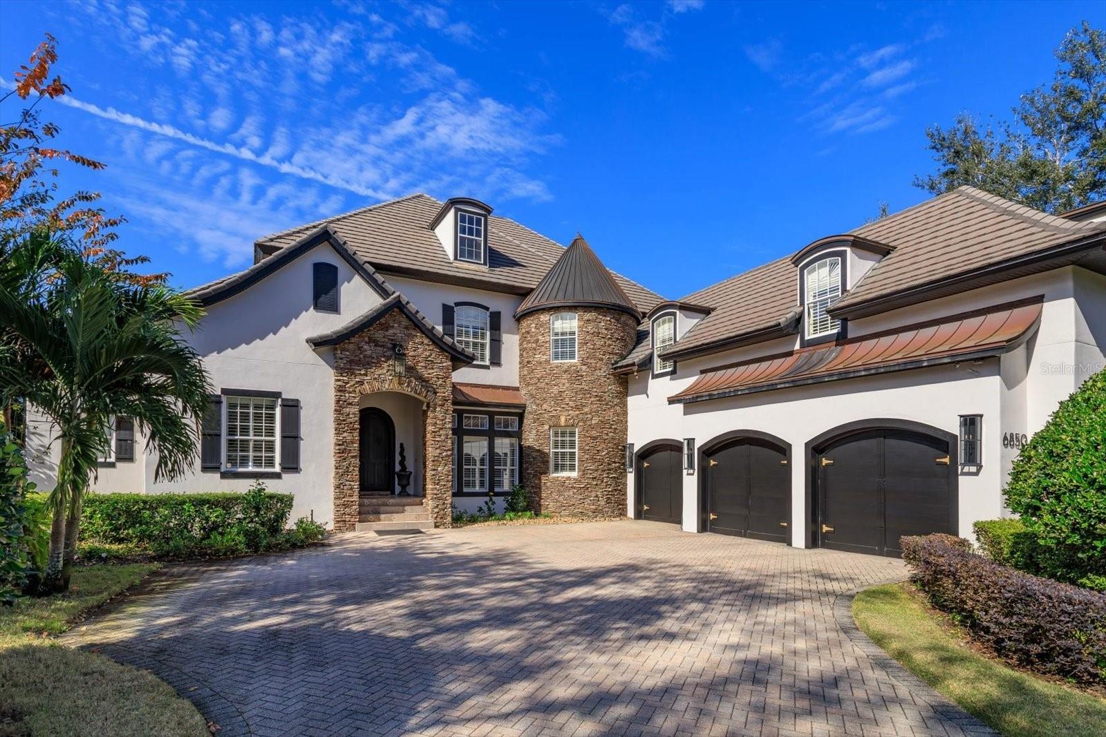 Combining timeless French Country architecture with the luxuries and design of the modern world, is what this Keene’s Pointe golf estate is all about. Originally designed and built by much-respected Goehring and Morgan, this home offers everything today’s discriminating buyer is looking for in a luxury property. Perfectly positioned overlooking the 14th fairway of The Golden Bear golf course, with over 5,200 square feet, the home has everything you need and want with 5 bedrooms, 5 full baths, 2 half baths, office, loft, and flex space (the 5th bedroom suite is currently being used as an amazing home theater). The primary living areas offer unobstructed golf views with an elaborate stone fireplace, intricate ceiling design, and lovely travertine flooring create comfort and elegance. The office is large with custom mill work and mahogany custom built-ins. The oversized master suite offers a private sitting area overlooking the sunny pool and golf views. The gourmet kitchen is designed for a chef’s delight, with custom cabinetry, stainless appliances, exotic granite. The family, dining, and kitchen areas open to the two-story family entertainment room with an awe-inspiring staircase. The entire home wraps around a beautiful pool with the two outdoor covered lanais complete with summer kitchen. With expansive decking, outdoor shower and bath, all overlooking the Jack Nicholas course, this is truly paradise.