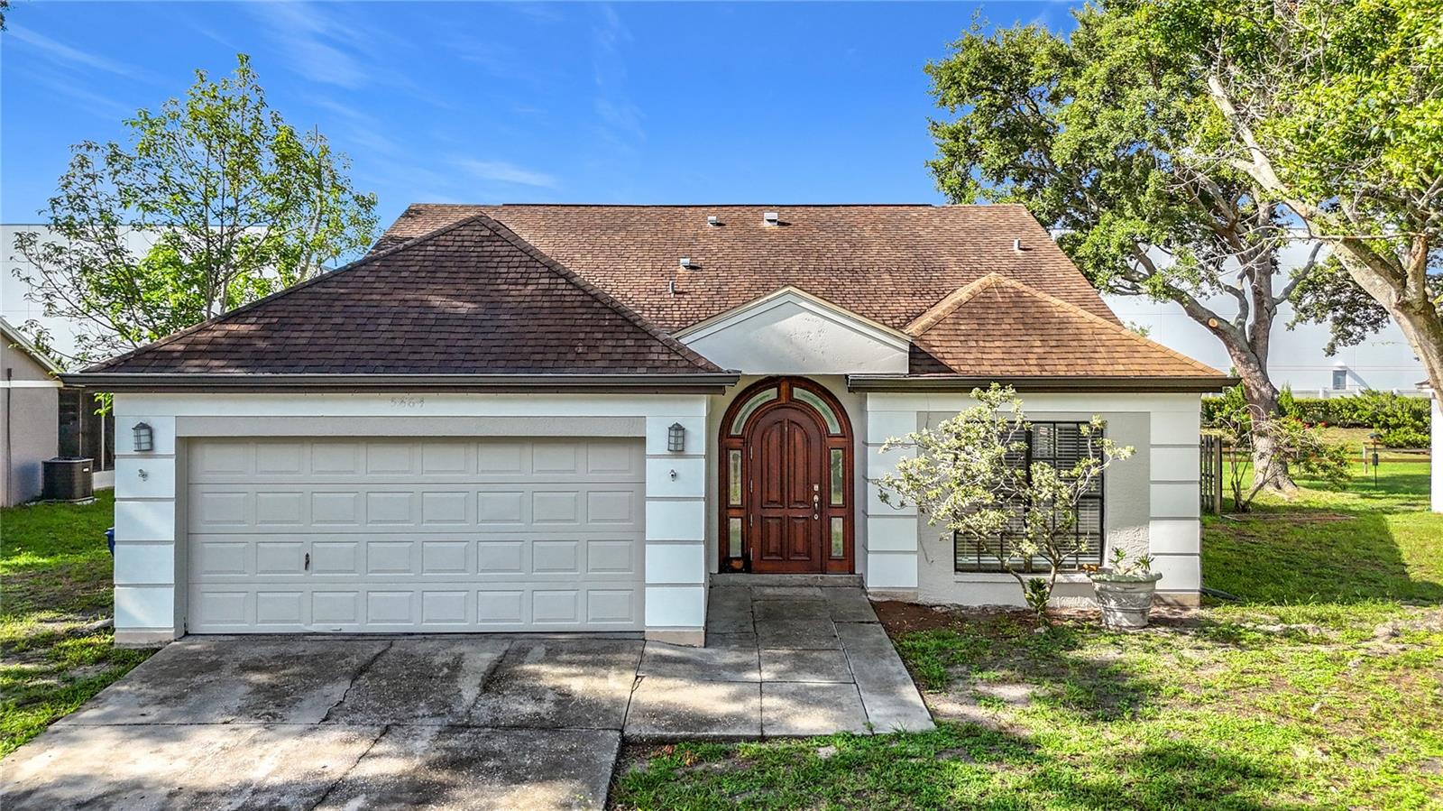 This home offers FOUR IMPRESSIVELY SIZED BEDROOMS, a SPACIOUS 22X16 GREAT ROOM, a GENEROUS 13X10 DINING ROOM, and convenient INSIDE LAUNDRY—all ideal for large families, multigenerational living, or anyone needing extra space for a home office or playroom. Big windows throughout allow NATURAL LIGHT to pour in, giving the entire home a warm, inviting feel. The primary suite includes a vaulted ceiling, a walk-in closet, and a well-appointed en suite bath with a roomy step-in shower, a private water closet, and a double vanity with a dedicated makeup area. And the outside is just as good as the inside. The LARGE FENCED YARD gives pets and little ones plenty of space to run, along with a massive 34x9 patio, which makes it perfect for entertaining—there’s even room to add a pool. While the 2-CAR GARAGE and double-wide driveway offer tons of storage and parking, best of all, NO HOA and NO DEED RESTRICTIONS mean extra cars, boats, and RVs are welcome. Just think...no hassle and no fees! For first-time buyers looking for a home they can actually grow into—this one delivers. Skip the overpriced “remodels” with sloppy finishes and unpermitted conversions. Here, you get solid bones and a flexible layout you can modify and update at your own pace and in your own style. Investors, pay attention as well: This large home with NO SHORT-TERM RENTAL RESTRICTIONS is a rare find. A property this size and in this location could command top rates. It would even make an exceptional vacation rental for large families and/or group travelers. As you know, it’s ALL ABOUT LOCATION…and it doesn’t get better than this! Where else can you enjoy being tucked away in a quiet, friendly neighborhood yet still have the world at your fingertips? Here, the post office, Walmart, Sam’s Club, Oneco Elementary, and the AMC 20 movie theater are conveniently located within walking distance. And thanks to easy access to US-301 and I-75; Sarasota International Airport, Downtown Bradenton, Downtown Sarasota, Manatee Memorial Hospital, IMG, world-class golf courses, spectacular sugar sand beaches (like those on Anna Maria Island & Siesta Key), along with every shopping and dining establishment imaginable in and around University Town Center are mere minutes away. COME SEE THE POTENTIAL for yourself! These sellers are ready to close.