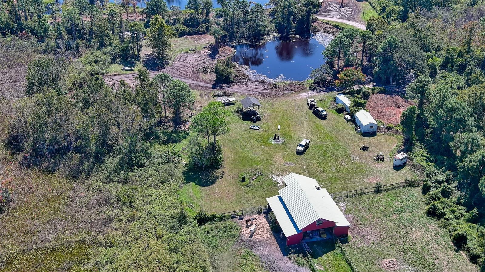 15 +/- acres of beautiful Florida land.  It has a deep ponds on property with 47 x 46 barn with loft and 8 horse stalls.  Fenced and crossed fenced with no climb horse fence.  Pole barn. Located on the Oak Hill Edgewater line.  This property has beautiful shade trees and tranquility.  Private location yet convenient to shopping and I-95. Possible owner financing with substantial downpayment.