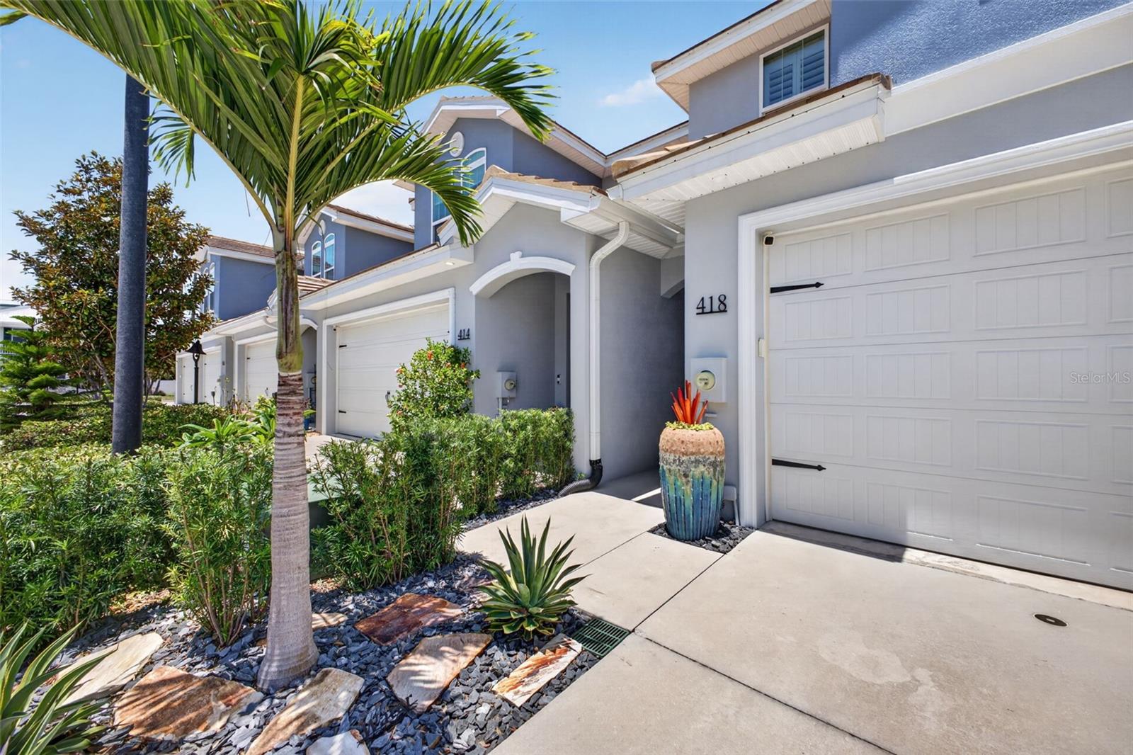 Live the Dunedin lifestyle you’ve been dreaming of in this golf-cart friendly community at 418 Birdsong Lane! Offering low-maintenance living with thoughtful upgrades already completed, this beautifully updated townhome combines modern comfort with the convenience of one of Tampa Bay’s most sought-after locations.
Built in 2018, this 3-bedroom, 2.5-bath residence offers 1,708 square feet of well-designed living space. Inside, you’ll find soaring 9-foot ceilings, 8-foot interior doors, fresh interior and exterior paint, durable plank tile flooring, and matching quartz countertops throughout for a cohesive, elevated feel.
The kitchen is both stylish and functional, featuring soft-close wood cabinetry, a large pantry, breakfast bar, new Bosch refrigerator, and a 5-burner gas range with griddle insert—perfect for everyday living and entertaining alike.
Upstairs, retreat to the spacious primary suite with dual walk-in closets and an ensuite bath complete with dual vanities, updated mirrors and lighting, a garden tub, separate shower, and linen closet. Two additional generously sized bedrooms, a full bath, and a convenient upstairs laundry room complete the second floor. The laundry space is enhanced by custom bi-fold doors (May 2026), and the washer and dryer convey.
Additional upgrades include plantation shutters upstairs, dimmer switches throughout, new Fanimation ceiling fans, remote-controlled slider shade, custom stair railings and banister, updated hardware door hardware, tankless water heater, Low-E hurricane impact windows, hurricane shutter for the slider, and a newer hurricane-rated garage door. The 2018 HVAC system features dual-zone climate control for added comfort.
Step outside and enjoy everything that makes Dunedin special—walk, bike, or take your golf cart to vibrant Downtown Dunedin for local restaurants, breweries, boutiques, markets, and year-round events. Spend weekends exploring the Pinellas Trail, relaxing at Honeymoon Island, or enjoying nearby Clearwater Beach.
Located in Flood Zone X with exterior maintenance included through the HOA, this move-in-ready home offers easy Florida living in the heart of it all.