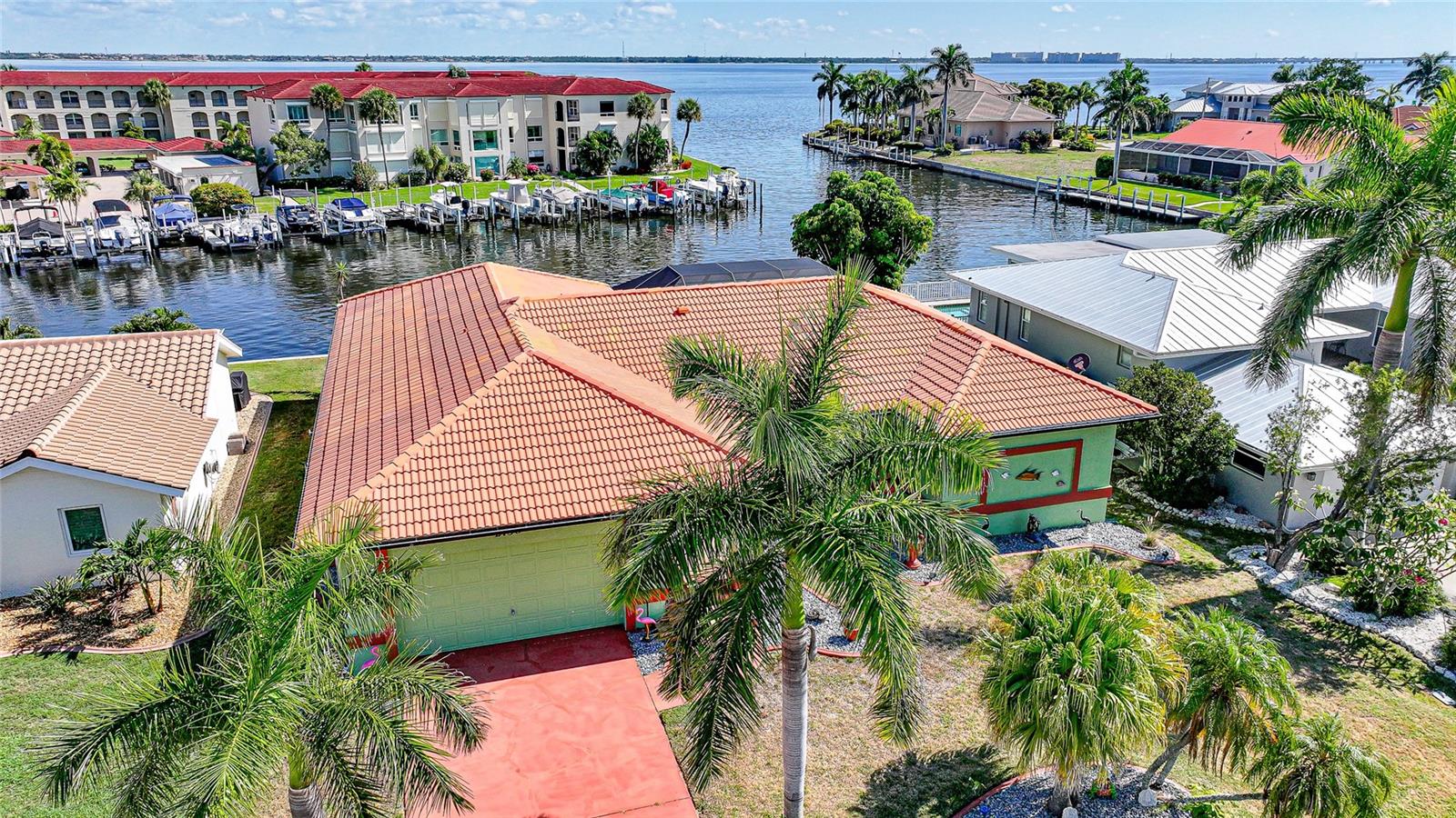 Unbelievable location in Punta Gorda Isles with an amazing view and direct access to Charlotte Harbor!!! Experience the best of waterfront living in this exceptional sailboat-access home, perfectly positioned on a prime canal with breathtaking views and direct access to Charlotte Harbor. With approximately 80 feet of city-maintained concrete seawall, replaced by the city in 2016, this property is a boater’s dream, offering quick access to open water in less than a minute.
This turnkey furnished residence features 3 bedrooms, 2 bathrooms, and a 2-car garage, along with a 33-foot concrete dock installed in 2023 and a heated swimming pool, (heat pump 2023) creating the ideal setting for enjoying Southwest Florida’s waterfront lifestyle. The spacious floor plan includes a formal living room, formal dining room, and a separate family room, providing ample space for both entertaining and everyday living.
The kitchen has granite countertops, updated appliances, including washer and dryer installed in 2023, and views overlooking the lanai and pool area. The primary suite serves as a private retreat with sliding glass doors to the lanai, dual walk-in closets, double vanities, a soaking tub, separate shower, and private water closet toilet. Two guest bedrooms provide comfortable accommodations, including one with direct lanai access, while the guest bathroom doubles as a convenient pool bath.
Additional features and updates include tile flooring throughout most of the home, an electric fireplace with customizable color-changing features for ambiance, a new pool cage screen (2024), new electrical panel (2023), pool heat pump (2019), A/C system (2020).
Offered completely furnished, including lanai furniture, grill, and smoker. This move-in-ready waterfront retreat allows you to immediately begin enjoying the Florida lifestyle. Bring your boat, yacht, sailboat, or jet skis and take advantage of one of Punta Gorda’s most desirable boating locations, where world-class fishing, cruising, and waterfront dining are just moments away.
A rare opportunity to own a true waterfront paradise with spectacular views, and outstanding boating access.
Location doesn’t get much better than this!