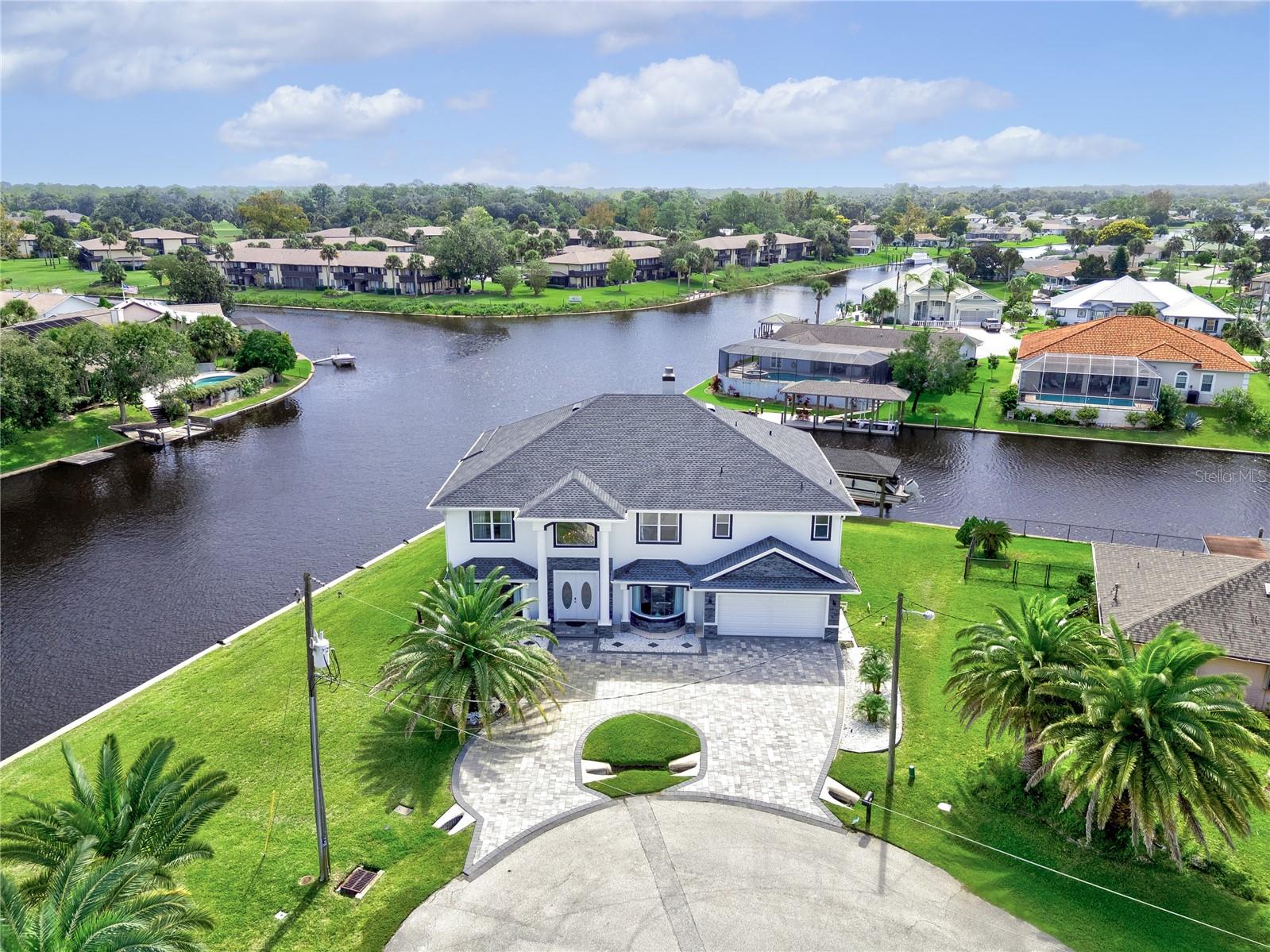 Welcome to a rare waterfront masterpiece at 16 Florence Ct, perfectly positioned on an expansive tip lot offering approximately 248 feet of saltwater canal frontage with quick access to the Intracoastal Waterway in just minutes.
This exceptional coastal retreat spans over 4,000 square feet and features 6 spacious bedrooms and 4.5 bathrooms, thoughtfully designed to capture breathtaking water views from nearly every room. From the moment you enter, you are greeted with light-filled living spaces and panoramic waterfront scenery that defines true Florida luxury living.
Step outside to your private outdoor oasis, where a screened-in pool and lanai create the perfect setting for both relaxation and entertaining. Enjoy peaceful mornings watching dolphins glide through the canal, and unwind in the evenings with stunning sunset reflections over the water from the expansive second-floor balcony.
Boating enthusiasts will appreciate the multiple boat basins and private dock, along with a 6,000 lb boat lift, making this a dream location for those seeking effortless access to the Intracoastal.
Recent upgrades provide peace of mind and modern comfort, including:
New roof
New HVAC system
New water heater
New dishwasher
New pool pump
New circular paver driveway
New Beautiful Porcelain Flooring on the first floor
New security system with cameras Adding even more value, high-end furnishings are negotiable, and a 25-foot boat (accommodating up to 14 passengers) may also be included, offering a true turnkey waterfront lifestyle.
Whether you’re searching for a full-time residence, a luxurious vacation home, or a high-performing investment opportunity, this property offers an unmatched combination of location, space, and lifestyle.
This is more than a home—it’s a waterfront experience. Opportunities like this are truly rare.
