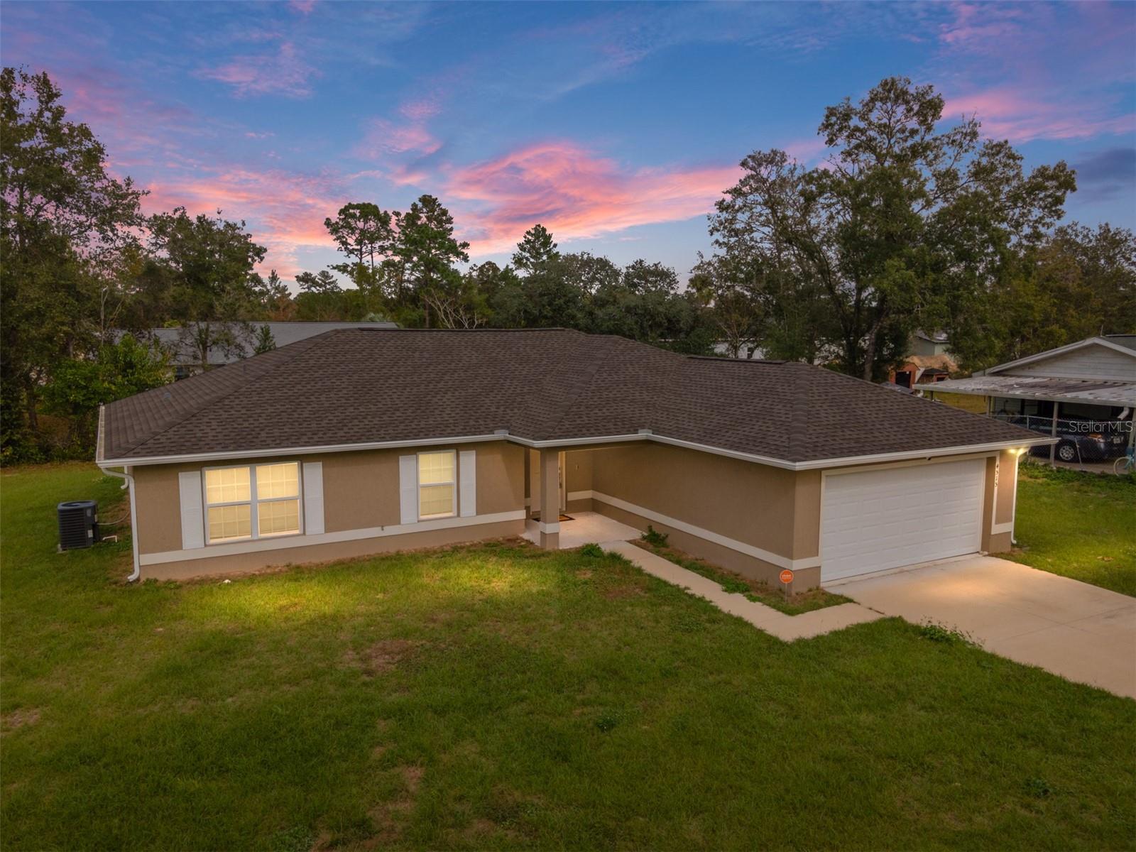 Start off your New Year in this newly built 2021 move-in ready home situated in the perfect oversized corner lot. At over 1700 sq ft of living space, this spacious split floorplan has 4 bedrooms. Covered foyer entry, cook's dream kitchen offers newer stainless appliances, rich dark wood cabinetry and dining area that is perfect for weeknight suppers or game night with friends. The principal suite is large with walk in closet, luxurious bath has tub/shower combo, large vanity with tons of storage space.  Relax and unwind after a long day on your screened in patio. You are just minutes from shopping, entertainment and the major highways.  Short drives in any direction to beaches and theme parks.  Start 2024 in your Florida dream home.