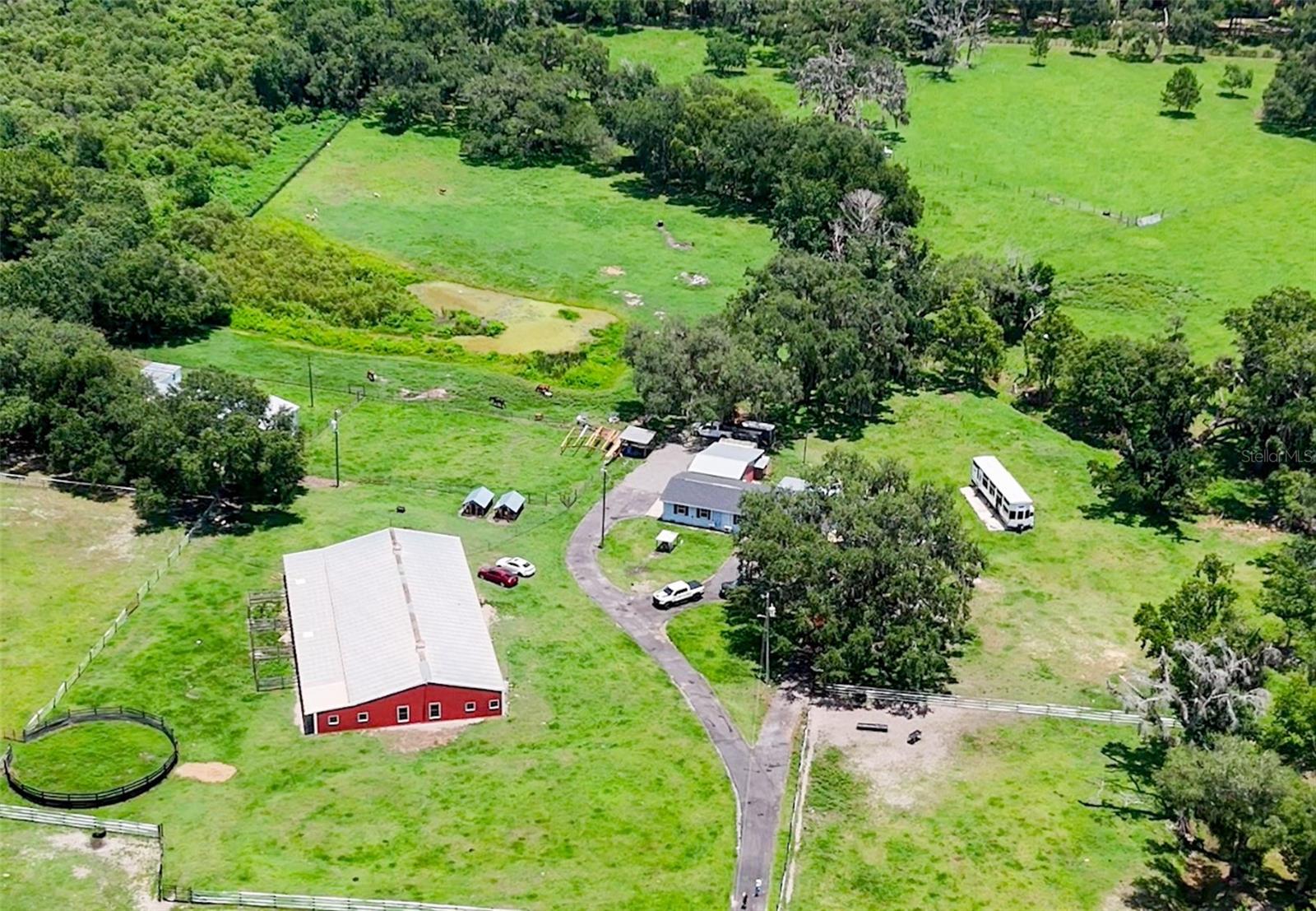 Discover an extraordinary opportunity to own a remarkable 20-acre estate that perfectly blends luxury, functionality, and endless possibilities. This exceptional property features two separate residences, offering a combined total of 6 bedrooms and 5 bathrooms. Designed for those who appreciate space, privacy, and country living without sacrificing comfort, the estate includes an approximately 6,000-square-foot barn ideal for horses and a variety of livestock. The property is currently home to horses, cattle, goats, ducks, geese, and other animals, making it an outstanding choice for equestrian enthusiasts, agricultural operations, or anyone seeking a true farm and ranch lifestyle. Zoned AR (Agricultural Residential), this unique estate offers exceptional flexibility for agricultural use, livestock, equestrian facilities, or a multigenerational family compound. The expansive acreage provides abundant room for future improvements, additional structures, recreational activities, or simply enjoying the peace and beauty of your own private retreat. Whether you’re searching for a private family estate, an income-producing opportunity, an equestrian property, or a one-of-a-kind agricultural investment, this extraordinary 20-acre property delivers unmatched versatility, breathtaking space, and limitless potential.