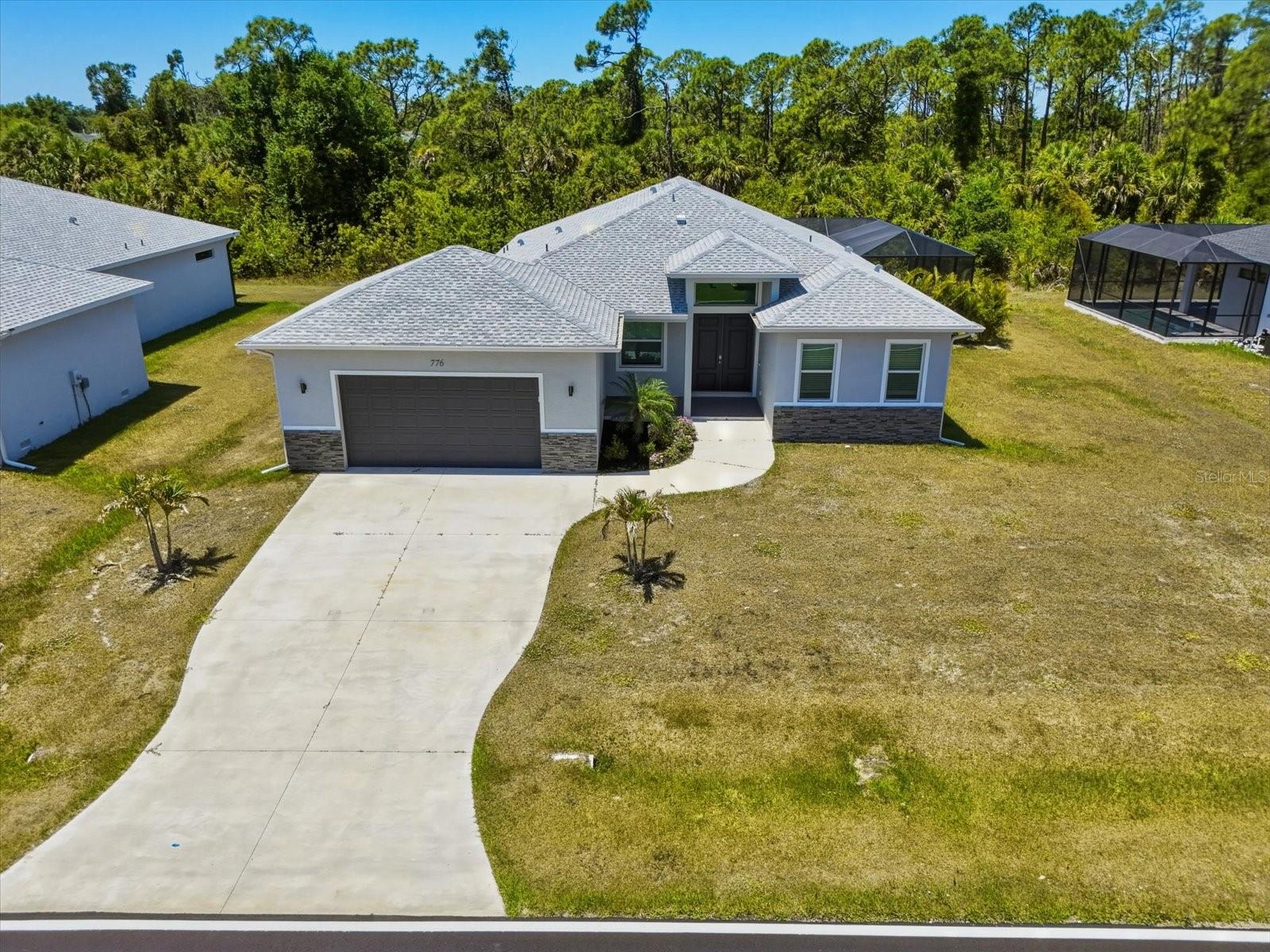 TURNKEY 2024 POOL & SPA HOME IN ROTONDA WEST — IMPACT WINDOWS, FLOOD ZONE X, OVERSIZED LOT, CLOSE TO GULF BEACHES, AND NO LEASE RESTRICTIONS! Welcome to 776 Rotonda Circle, a beautifully completed 4-bedroom, 3.5-bath, 2-car garage home offering 2,225 sq. ft. of refined Florida living and 3,146 total sq. ft. in the highly desirable GOLF COMMUNITY of Rotonda West. Set on an oversized 12,119 sq. ft. lot near area golf courses, this home blends modern construction, elegant finishes, and resort-style outdoor living in one exceptional package.

From the moment you arrive, the quality stands out. Built in 2024 with a hip roof, stem wall foundation, block construction, hurricane IMPACT windows, and a spacious 24'x23' garage, this home offers the peace of mind today’s buyers are searching for. Inside, the open-concept layout is bright, spacious, and beautifully finished with porcelain tile flooring throughout, high ceilings, ceiling fans, solid wood cabinets, GRANITE counters, and a thoughtfully designed split-bedroom floor plan. The home is also being offered TURNKEY, making it ideal as a full-time residence, seasonal retreat, or investment property.

The heart of the home is the stunning open kitchen, featuring a LARGE, 10' ISLAND, pantry, granite counters, solid wood, soft-close cabinetry, and a full appliance package including refrigerator, range, microwave, dishwasher, disposal, washer, and dryer. The kitchen flows seamlessly into the dining area and expansive living room, where tray ceilings add architectural detail and sliding glass doors open to the screened outdoor living space—creating the perfect setup for entertaining, relaxing, and enjoying the Florida lifestyle. 

The primary suite is generously sized and features a tray ceiling, walk-in closet, ceiling fan, and a spa-inspired en-suite bath with granite counters, makeup/vanity space, multiple shower heads, a walk-in shower, soaking tub, and beautiful natural light. A SECOND EN-SUITE style bedroom with walk-in closet provides wonderful flexibility for guests, multi-generational living, or extended stays. Two additional bedrooms, a full guest bath, convenient half bath, and an interior laundry room complete the well-planned interior.

Step outside to your private resort-style retreat. The screened lanai, oversized pool deck, heated pool, and heated spa create an incredible outdoor living experience. The covered lanai features plenty of space for lounging or dining, while the pool area overlooks a peaceful greenbelt where YOU'LL NEVER HAVE REAR NEIGHBORS. An outdoor shower adds convenience after a swim or a day at the beach.

Located in Rotonda West, residents enjoy a beloved golf-cart-friendly community with deed restrictions, parks, playgrounds, sidewalks, tennis courts, clubhouse amenities, restaurant, and access to multiple golf courses. The home is also in Flood Zone X, with public water and public sewer, low annual HOA fees, pets allowed, and no minimum lease period—an excellent combination for lifestyle buyers and investors alike. CLOSE TO GULF BEACHES, boating, fishing, dining, shopping, and everything that makes Southwest Florida so desirable, this move-in-ready Rotonda West pool home delivers beauty, comfort, flexibility, and value. Schedule your private showing today!