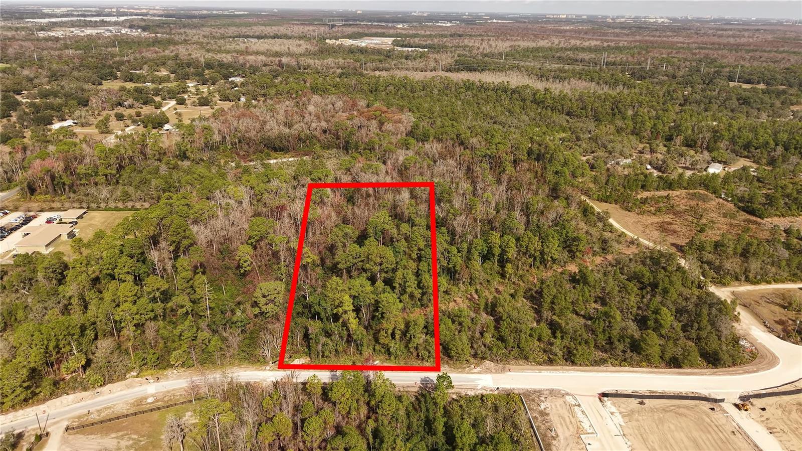 Rare opportunity to acquire 2.21 acres of well-positioned land in a rapidly growing area bordering Davenport & Kissimmee while offering strong potential for residential or agricultural development. Located in the path of progress, this property stands to benefit from continued expansion and increasing demand in the surrounding area. Enjoy convenient access to shopping, dining, major hospitals, and world-renowned attractions, with the established Ashebrook subdivision located directly across the way. Whether you’re an investor planning for future development or a buyer seeking a strategically located parcel with flexibility and long-term upside, this property offers an exceptional combination of location, growth, and opportunity.