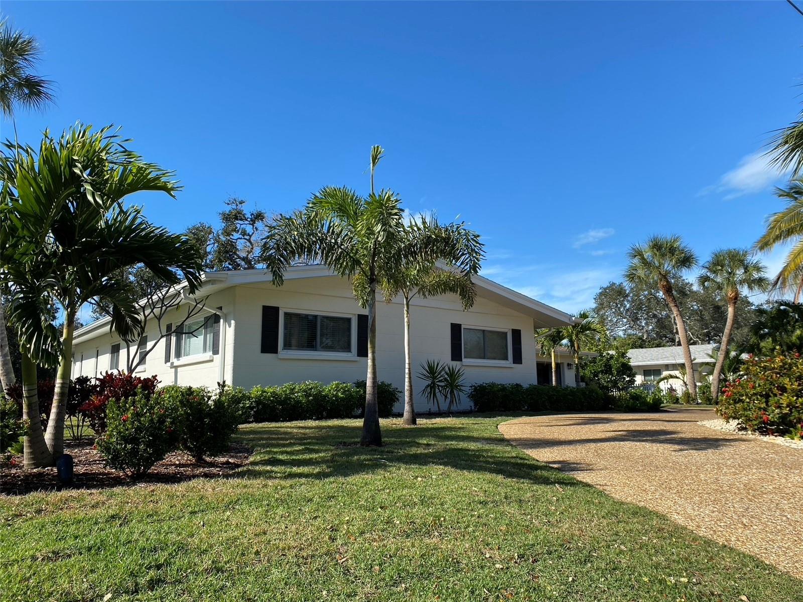 Exceptional Siesta Key waterfront residence offering a rare opportunity to own a turn-key, move-in-ready 4 bedrooms and 2 bathrooms home in one of the island’s most desirable and tranquil locations. Situated on a quiet cul-de-sac along a grand canal, the property provides privacy, scenic water views, and easy boating access to the Bay with only one higher bridge to navigate. A standout feature is the expansive Florida room, a light-filled living space designed for year-round comfort with floor-to-ceiling windows and seamless views of the water and surrounding greenery—ideal for relaxing or entertaining. The home has been thoughtfully maintained and is in excellent condition, allowing for immediate occupancy or rental income potential. Additional highlights include a heated pool, open and functional layout, and spacious living areas. Located just minutes from Siesta Key Beach and Siesta Key Village, this property combines prime location, generous living space, and waterfront charm, making it ideal as a primary residence, vacation home, or investment property. The house did not get flooded from the recent 2024 storms, a new roof was replaced in 2024, A/C was replaced in 2023, a pool heat pump was installed in 2023, re-piped and remodeled in 2022.