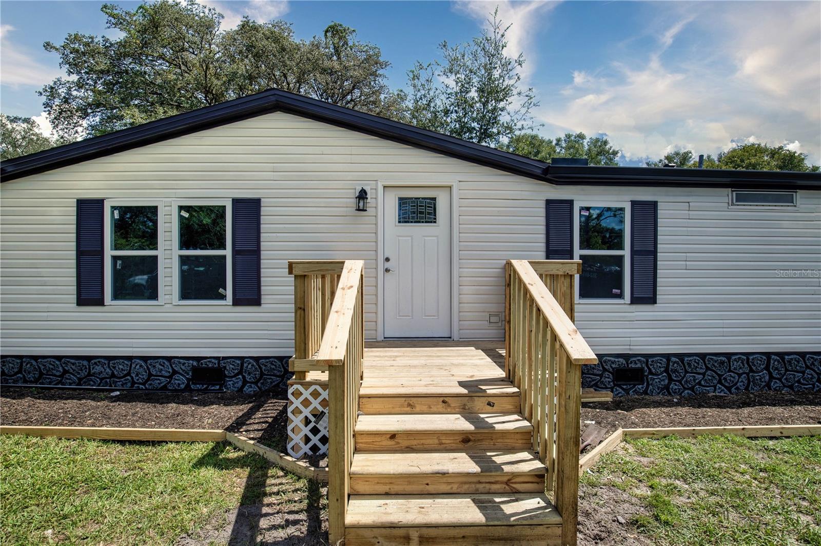 Take a tour of this stunning 4-bedroom 2-bathroom house located in the desirable Lake Weir Shores neighborhood! Nestled on a family-friendly street, you will find this immaculate home newly renovated from top to bottom, featuring all the bells and whistles you've been searching for. The long list of brand-new renovations includes a roof, AC, septic, plumbing, flooring, kitchen, bathrooms, drywall, doors and windows - and every inch is brand-new and waiting for you. Fall in love with this peaceful paradise and make it your own - with 1782 Sq.ft. of blissful living space, don't wait on this extraordinary opportunity any longer!