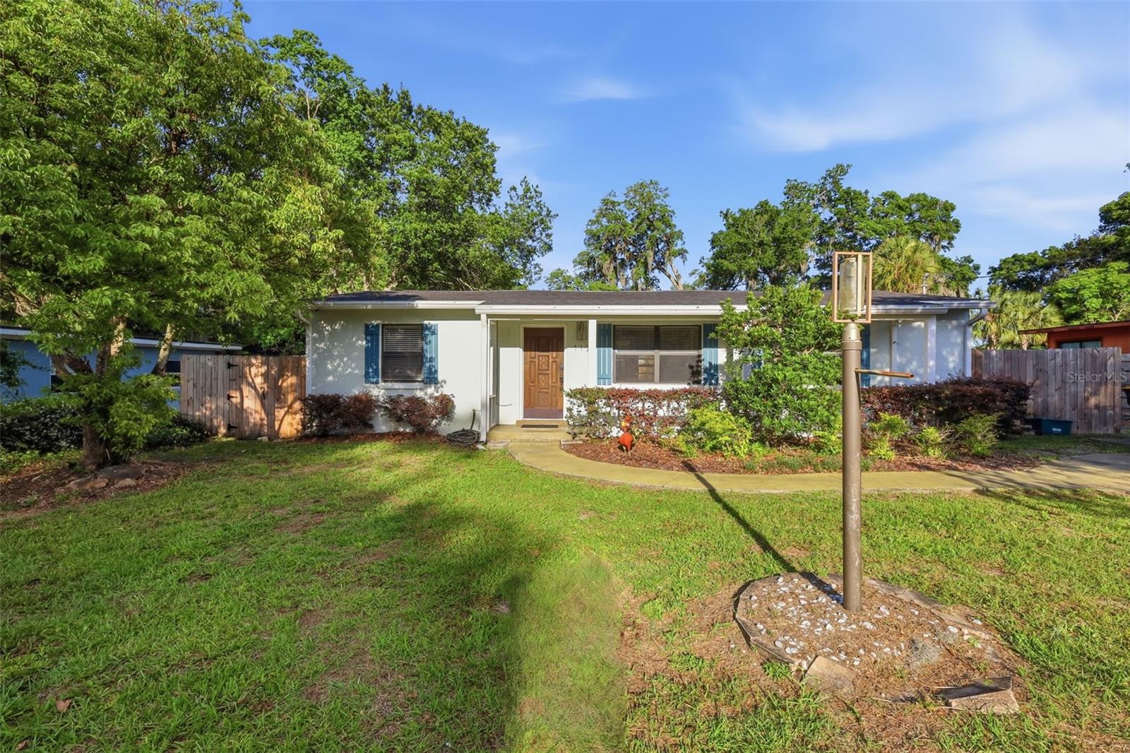 Charming NO HOA home in the heart of Orange City with a seller incentive offering 3% towards buyer’s closing costs and pre-paids with an acceptable offer. Ideally located close to downtown and city parks, and just a short drive to Blue Spring State Park, this home has been thoughtfully renovated with wood-look vinyl flooring, an updated kitchen, and refreshed bathrooms. Major updates include a NEW ROOF (2025) and a sturdy wood fence (2025), built to last with 6x6 corner and gate posts reinforced with concrete. The split floor plan offers privacy, with the primary suite on one side and secondary bedrooms on the other, while two separate living areas provide flexibility for both everyday living and entertaining. The oversized, fully fenced backyard gives you plenty of room to spread out, store your toys, or add future improvements, and includes a shed that will convey along with an existing power box already in place. Solar panels are leased at a low monthly rate of $98. With no HOA restrictions, you’ll enjoy the freedom to park boats, trailers, or campers with ease. Schedule your private showing today!