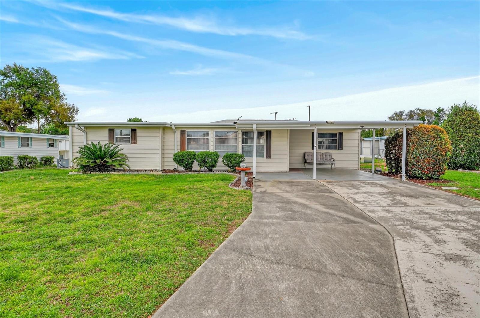 Perfectly positioned in the highly desirable community of Imperial Terrace West, this 3-bedroom, 2-bathroom home combines a thoughtful layout with everyday practicality. The interior features expansive living areas, including an oversized Florida room with ample windows for natural sunlight and a versatile additional bedroom/den/hobby room. A split floor plan strategically separates the bedrooms to enhance privacy. At the heart of the home, the bright, functional kitchen boasts a built-in oven, built-in microwave, a closet pantry, and a convenient breakfast bar for casual dining. The property offers ample storage both inside and out, including two sheds-one of which is equipped as a laundry room and conveniently accessible through the enclosed rear porch. Outside, a generous double carport provides shaded parking, offering the perfect spot for your golf cart! Enjoy peace of mind with a transferrable 10-year warranty on the Roof (2020). HOA/COMMUNITY: Imperial Terrace is a highly desirable 55+ retirement community offering AMENITIES galore! Community amenities include a clubhouse, boat slips, Harris Chain of Lakes access, shuffleboard courts, an indoor pool and hot tub, and so much more! Featuring a low HOA fee and NO LOT RENT - you OWN the land! Imperial Terrace is located off Hwy 441, just minutes from shopping, dining, entertainment, state-of-the-art medical facilities, PLUS, renowned local destinations - Mount Dora and The Villages! Easily commute to the beach coasts, Orlando attractions, airports and everywhere exciting that makes Floridians love living ‘central’ in the Sunshine State, year ‘round or seasonal. Call to schedule your personal tour today!