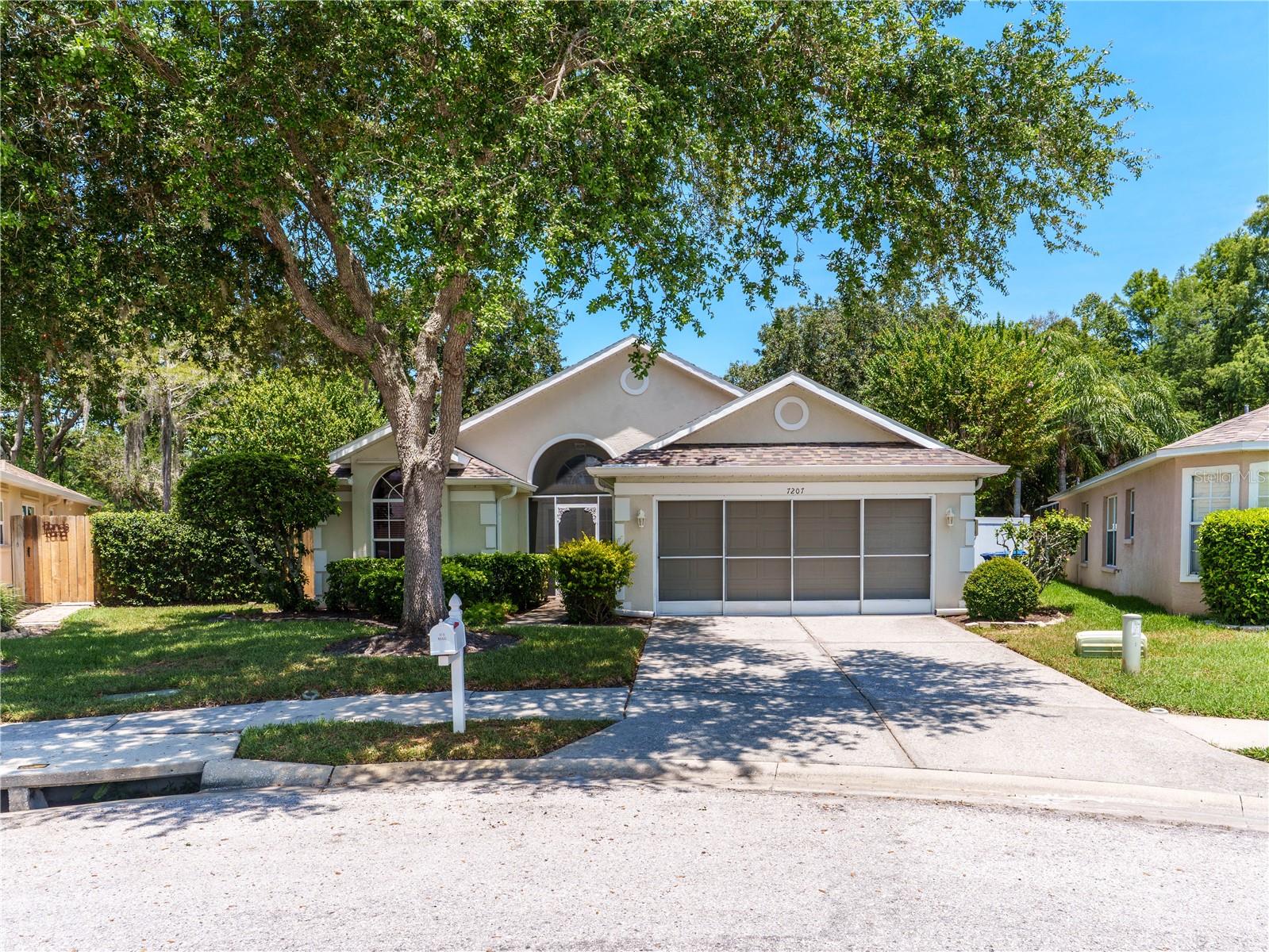 Welcome to this charming 3 Bedroom, 2 Bath - 2 Car Garage home almost  1600 square feet,  of beautifully laid out living space in a serene neighborhood .  No wasted space here.  Original owner since 1996.  The most outstanding feature of this home is the STUNNING VIEWS  of a tranquil LAKE  from the backyard.  Enjoy a peaceful morning coffee while taking in the water views, birds, and wildlife. If you enjoy privacy and nature - make sure you look at this one.  The home has been well maintained, but needs some updating, including flooring, as seller was using a walker to navigate around.  The kitchen has a nice eat-in area, a counter bar, and looks over to the Family Room.  Inside Laundry.  Enjoy the screened porch also.  There  are Hurricane Shutters, Rain Bird Sprinklers, Water Conditioner.  Pasco County Permits show Roof 2017 and Air System 2011.  Oh!!!  another great feature :  Home is  on a cul-de-sac.  Folks be quick on this one.