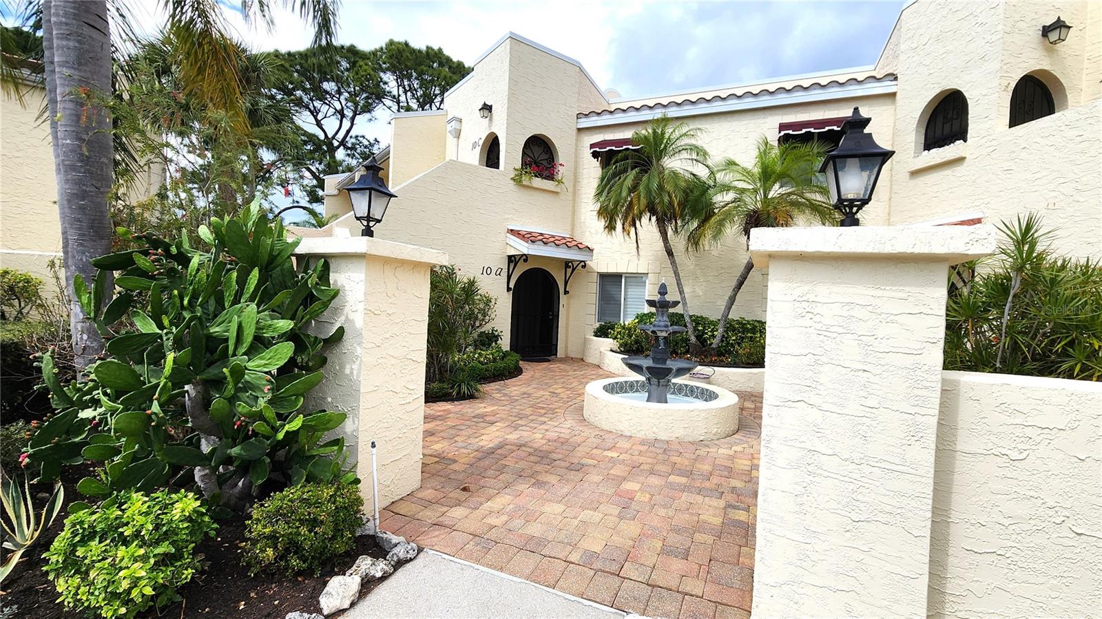 One or more photo(s) has been virtually staged. Welcome to this spacious 2-bedroom, 2-bath FIRST-FLOOR END-UNIT condo in the sought-after Vizcaya community, offering 1,341 square feet of living space and a great opportunity to add your personal touch. Perfectly positioned with a peaceful rear pond view, this residence provides both privacy and a serene setting to enjoy Florida living. Step inside to find tile and laminate flooring throughout, creating a clean, cohesive look with easy maintenance. The spacious layout flows effortlessly, with a bright living and dining area that opens through sliders to a fully screened lanai—ideal for enjoying your morning coffee while overlooking the tranquil water view. The primary en-suite is a true retreat, featuring TWO WALK-IN CLOSETS, a relaxing garden tub, and a separate stall shower. Both the primary bathroom and guest bedroom provide unique private access to a garden area ready for the next owner's personal touches, bringing added character and an inviting outdoor feel. 
Vizcaya's resort-style amenities include a heated pool and spa, clubhouse, fitness center, sauna, and library - all set among lushly landscaped grounds within this highly sought-after gated community. Attention Golf enthusiasts - Only minutes from IMG Golf & Country Club!
Conveniently located 12 minutes from SRQ Airport, 8-10 miles to St. Armands Circle, Lido Beach, and Anna Maria Island, shopping, dining, downtown attractions, golf, and so much more!