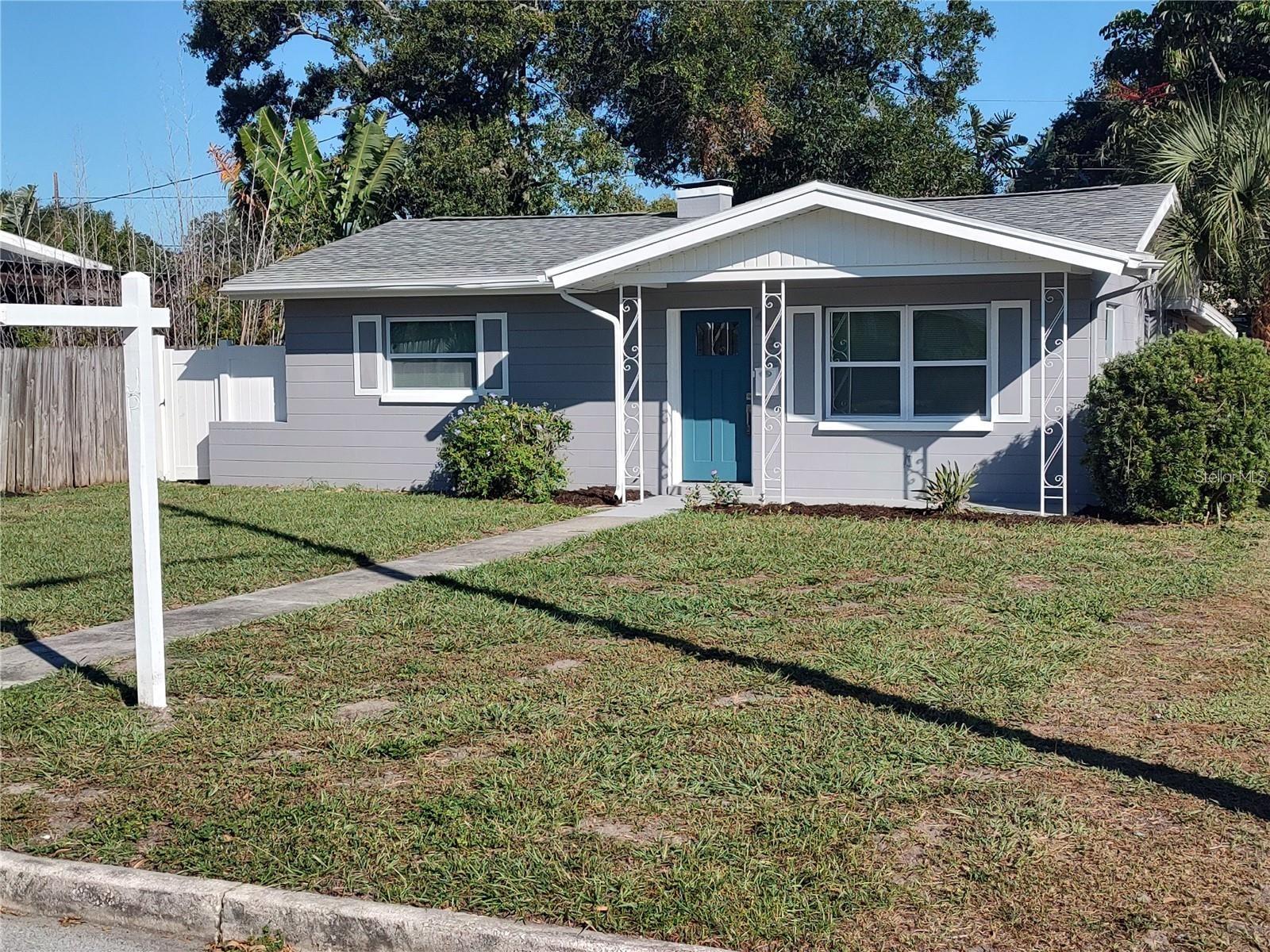 Welcome to this beautifully renovated block home in the heart of St. Petersburg! This move-in-ready residence features 2 bedrooms, 1 bathroom, and a versatile bonus room perfect for a home office, playroom, or additional living space. Thoughtfully updated from top to bottom, this home boasts a brand-new roof, impact-resistant windows, central air conditioning system, insulation, interior and exterior paint, and stylish flooring throughout. The stunning new kitchen showcases modern cabinetry, elegant granite countertops, and plenty of workspace for cooking and entertaining. The completely remodeled bathroom offers fresh, contemporary finishes. Step outside to enjoy the spacious, fully fenced backyard with convenient rear alley access, providing ample room for outdoor activities, pets, gardening, or future expansion. A covered carport adds everyday convenience and protection from the elements. Located in a desirable non-flood zone, this property offers peace of mind while being just minutes from vibrant downtown St. Petersburg, award-winning Gulf beaches, shopping, dining, parks, and entertainment. Don’t miss this opportunity to own a beautifully updated home in one of St. Petersburg’s most convenient locations!