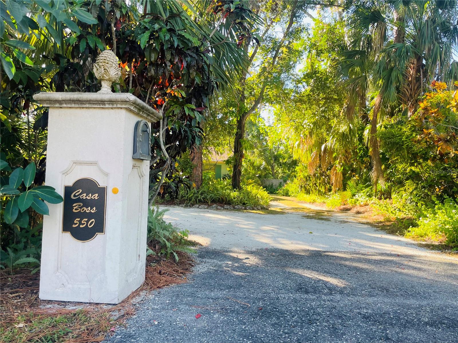 SIGNIFICANT PRICE IMPROVEMENT of over $200,000!! Nestled in a canopy of lush, tropical greenery in Indian Beach, this distinctive property captures the spirit of one of Sarasota’s most sought-after neighborhoods. A unique flag lot of over half an acre (25,378sf) with two separate driveways on different streets (front and back), this homesite represents an effortless blend of privacy, elegance, and accessibility, providing rare convenience and a true estate feel. An exceptional location just moments from iconic beaches, Sarasota Bay, Sapphire Shores Park, The Ringling Museum, Sarasota Jungle Gardens, SRQ Airport, and downtown Sarasota, this distinctive property affords a rare opportunity to reimagine the existing 1940's era homestead, or to create your own legacy home in a neighborhood that defines coastal sophistication.