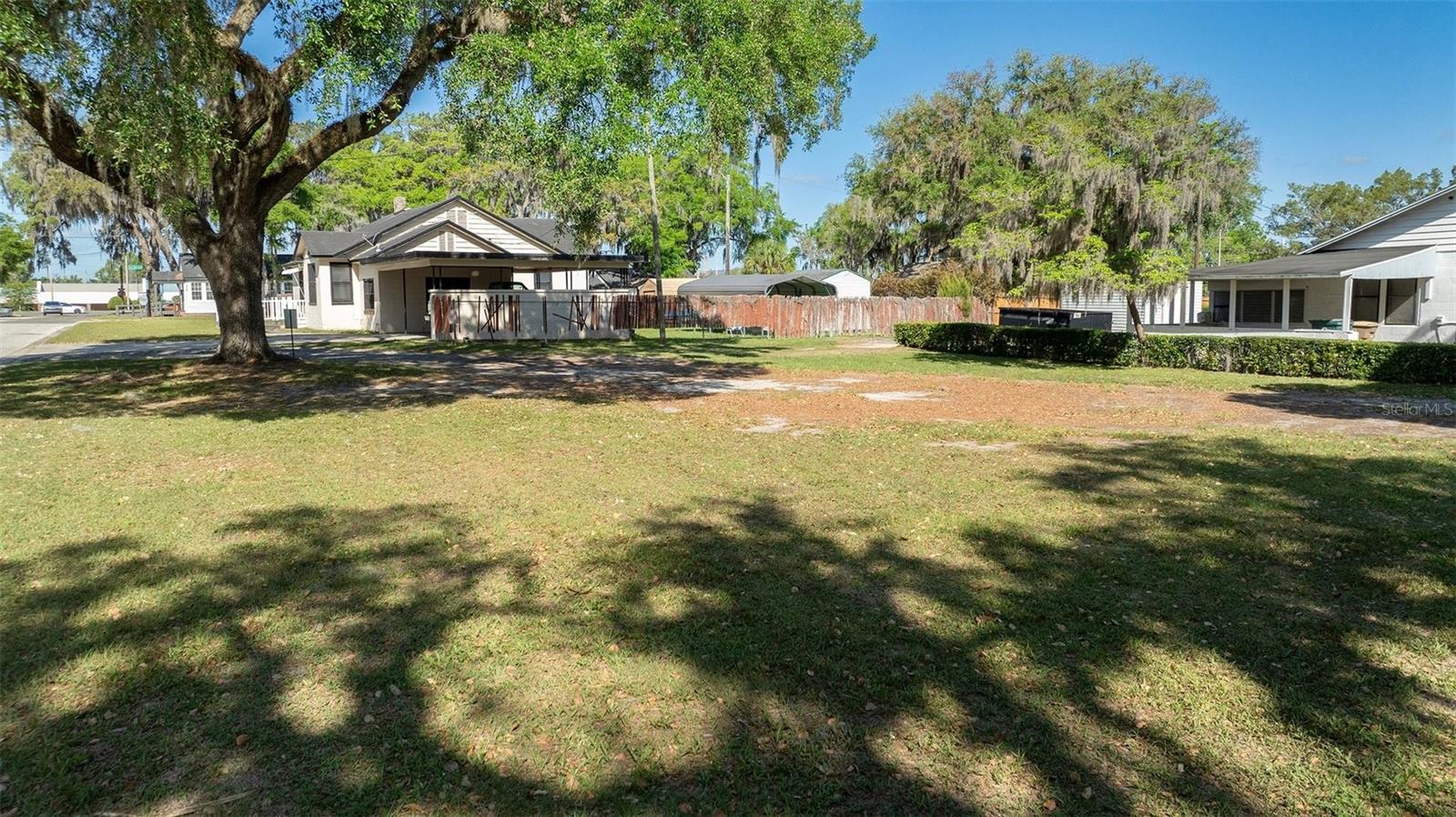 Serious opportunity has entered the chat in Downtown Ocala. This commercial vacant lot, formerly used as parking for the adjacent property, is now available for the next sharp-minded buyer who understands that location, positioning, and future potential still run the show. Whether the buyer is a commercial developer looking to assemble a stronger footprint or a small business owner ready to level up and establish a more credible downtown presence, this parcel deserves a hard look.

For commercial developers, this is where things get interesting. This lot is not just a standalone piece of land. It pairs naturally with the connected adjacent parcel and should be viewed through a bigger lens by anyone who knows how value is built through assemblage. Add in the possibility of including another nearby adjacent parcel at 219 SW 6th Street, and now the opportunity starts to look far more strategic. Three parcels together can create a much more meaningful downtown play for the right developer—one with flexibility for redevelopment, expanded site planning, parking strategy, mixed-use thinking, or a commercial concept built to serve the surrounding demand. Good developers do not just buy dirt. They buy position. This one has it.

The location only strengthens the case. Set just a stone’s throw from the US Post Office and only a few blocks from the Downtown Square, this property sits close to the center of the energy that keeps Downtown Ocala moving. The Square remains the heartbeat of downtown, bringing together commerce, foot traffic, local activity, and community connection. Add the draw of the Ocala Farmers Market every Saturday morning, and it becomes even clearer why land in this area carries real appeal. A smart site in a growing downtown setting can become the foundation for something that matters.

This lot also holds strong appeal for small business owners who are ready to move with intention. There is a big difference between simply operating a business and being seen as established in the community. A downtown address changes perception. It can elevate how a company is viewed by clients, customers, referral partners, and other professionals. For a small business trying to gain traction, strengthen its brand, or step into more serious professional circles, securing a foothold in a downtown environment can be a game-changing move. The right build, paired with the right location, can help a business look more rooted, more credible, and more connected to the pulse of the city.

Whether the long-term vision is office use, service-based commercial space, boutique business presence, redevelopment, or a broader assembled-site concept, this parcel offers the kind of flexibility that lets smart buyers think beyond the obvious. It is just a few blocks off N Pine Avenue, which adds practical accessibility to the list of advantages. Easy to reach. Easy to recognize. Easy to imagine what comes next.

This is one of those opportunities where today’s vacant lot can become tomorrow’s strong statement. Build something that serves the area. Combine parcels and create a more serious development story. Or plant a business flag in a downtown setting that instantly says growth, professionalism, and presence.

Let your entrepreneurial spirit run wild with this commercial lot. For the developer, it is a chance to think bigger. For the small business owner, it is a chance to step up. Either way, Downtown Ocala is where the next move begins.