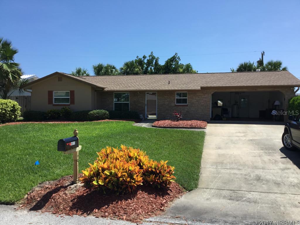 Lovely 2/2 with a 2 car garage on the beach side. Open floor plan with island kitchen. Tile in the kitchen/living room/dining room. City water & Septic. Immaculately maintained yard with irrigation hooked to a well. French doors lead to a large screened in back porch for enjoying the ocean breezes