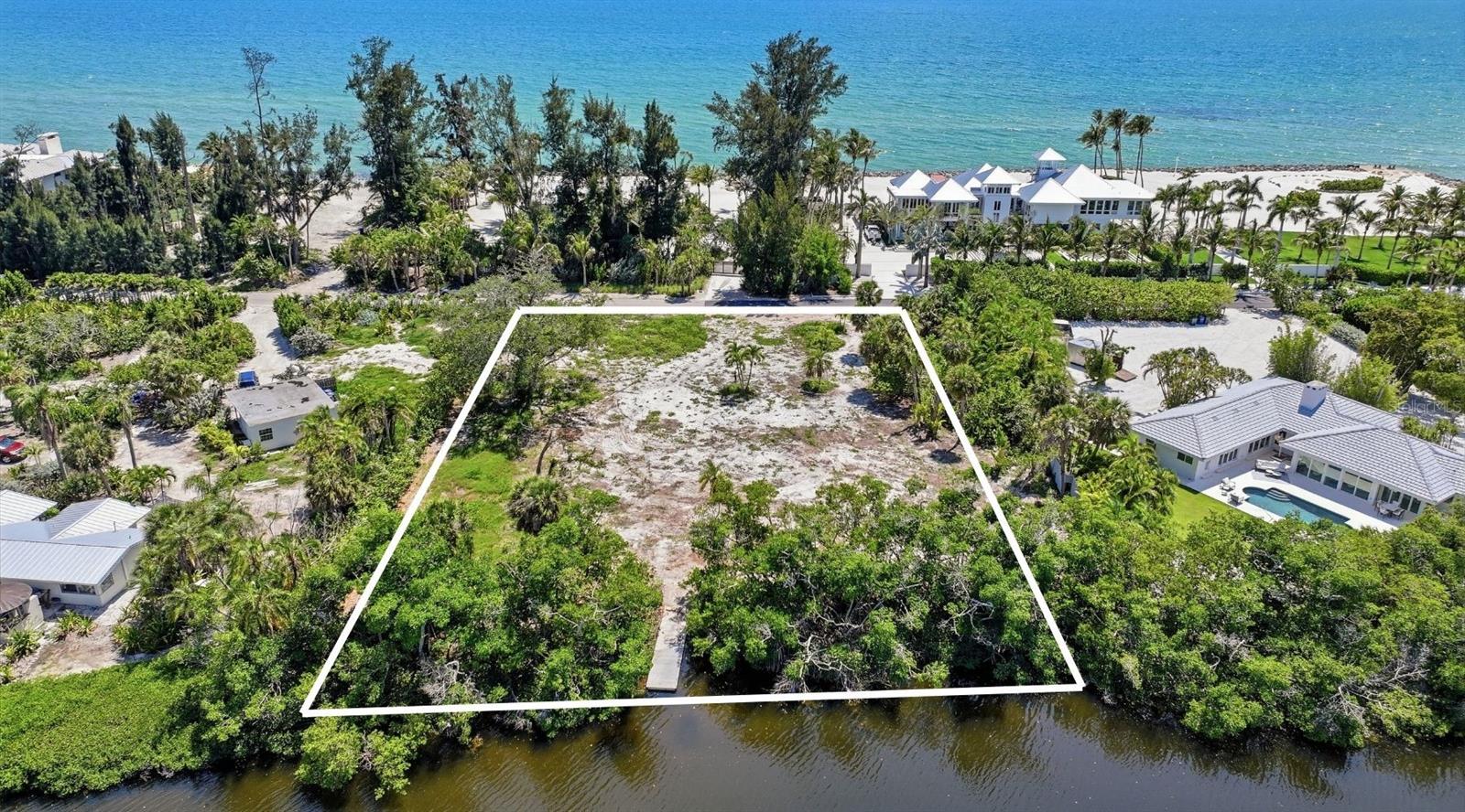 Positioned on nearly an acre within the prestigious, guard-gated enclave of The Sanderling Club on Siesta Key, this exceptional waterfront homesite presents a rare opportunity to create a custom coastal estate in one of Sarasota’s most coveted communities. With over 180 feet of frontage on Heron Lagoon and the Gulf across the street, expansive water views and sunsets are everywhere creating the idyllic setting for a remarkable new residence designed to embrace Sarasota’s year-round outdoor lifestyle. The generous dimensions and waterfront setting provide the flexibility to envision everything from a contemporary architectural statement to a timeless island-inspired retreat. Residents of The Sanderling Club enjoy an unmatched lifestyle defined by privacy, security, and exclusive amenities, including a private marina, deeded beach access, 24-hour guard-gated entry, tennis, pickleball, and a casual Gulf front clubhouse. Just moments away, Siesta Key Beach, consistently ranked among America’s finest beaches and currently No. 1 by TripAdvisor, is renowned for its powder-soft quartz sand, turquoise Gulf waters, and unforgettable sunsets. Nearby, Siesta Key Village offers a vibrant collection of restaurants, cafés, boutiques, live music, and island gathering spots, creating an atmosphere that is both relaxed and distinctly coastal. Combining the privacy of The Sanderling Club with convenient access to Siesta Key’s beaches, restaurants, boutiques, and coastal recreation, this exceptional homesite offers the opportunity to create a custom residence tailored to an unparalleled island lifestyle.