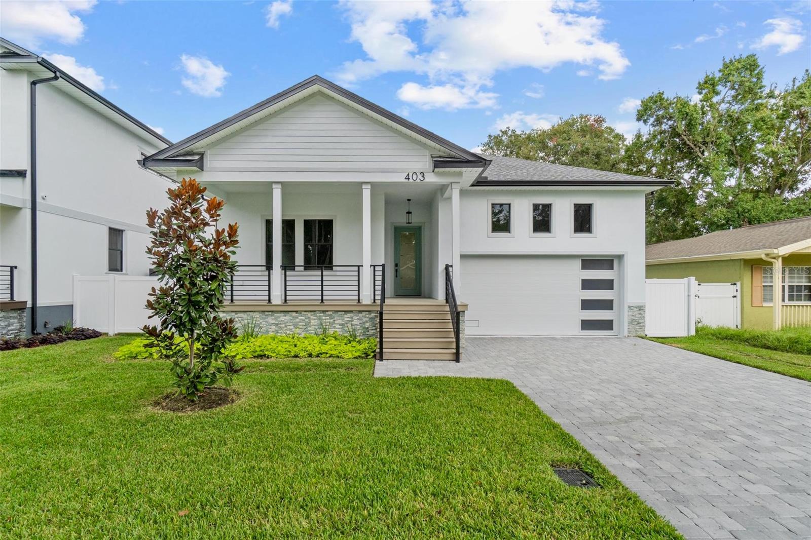 One or more photo(s) has been virtually staged. Welcome to 403 Park Blvd, a brand-new 2025 luxury residence offering elevated one-level living in the heart of Tampa Bay. Set at a secure 12’ elevation and built with concrete block construction, full impact-rated windows & doors, spray foam insulation, this home delivers the peace of mind discerning buyers expect in Florida. Inside, you’ll find 10’ ceilings, wide-open living spaces, and designer finishes that balance modern style with everyday comfort. The chef’s kitchen features Bosch stainless appliances, quartz countertops, a waterfall island, and butler’s pantry—perfect for entertaining or family gatherings. Bathrooms showcase frameless glass showers, quartz vanities, and a spa-inspired free-standing tub in the master suite. With 4 bedrooms, 3.5 bathrooms, 2 car garage and over 2,900 sq ft of living space, this home was designed for both elegance and efficiency. Additional highlights include smart-home prewiring (CAT6, surround, surveillance), luxury flooring throughout, and a GE washer/dryer package. Step outside to enjoy Florida living on a covered porch and expansive deck, with paver driveway, vinyl privacy fencing, irrigation system, and lush landscaping. Perfectly situated, Oldsmar offers a rare blend of tranquility and convenience—you’re less than 20 minutes from Downtown Tampa, Tampa International Airport, and the award-winning beaches of Clearwater and Honeymoon Island. With parks, waterfront trails, and community events just down the road at R.E. Olds Park, this location captures the best of Tampa Bay living.  Seller is offering a $30,000 credit to buyers at closing—perfect for covering closing costs, an interest rate buy-down, or upgrades.
This is more than a home—it’s new construction built for luxury, resilience, and lifestyle, in one of the region’s most connected hidden gems.