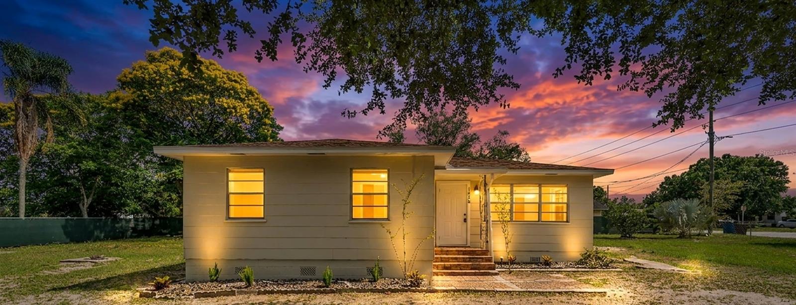 Virtually Staged. Welcome to 1050 Pine Ave in Lake Wales, a hidden gem offering 3 bedrooms, 2 bathrooms, and 1,380 square feet of living space on an impressive .36-acre oversized lot. Freshly painted inside and out, this home welcomes you with modern new doors, blinds, updated light fixtures, and ceiling fans. The main living areas feature beautiful rustic hardwood floors, while the kitchen and bonus room offer durable luxury vinyl plank flooring for everyday convenience. Both bathrooms have been fully renovated, giving the home a fresh, modern feel throughout.  
Outside, the oversized yard is the true standout, offering a wonderful amount of space for entertaining, gardening, outdoor dining, pets, play areas, or future backyard enhancements. The outdoor shed provides additional storage, while the large lot gives this property a rare sense of privacy and flexibility. This home offers charm, updates, and room to enjoy the Florida lifestyle.