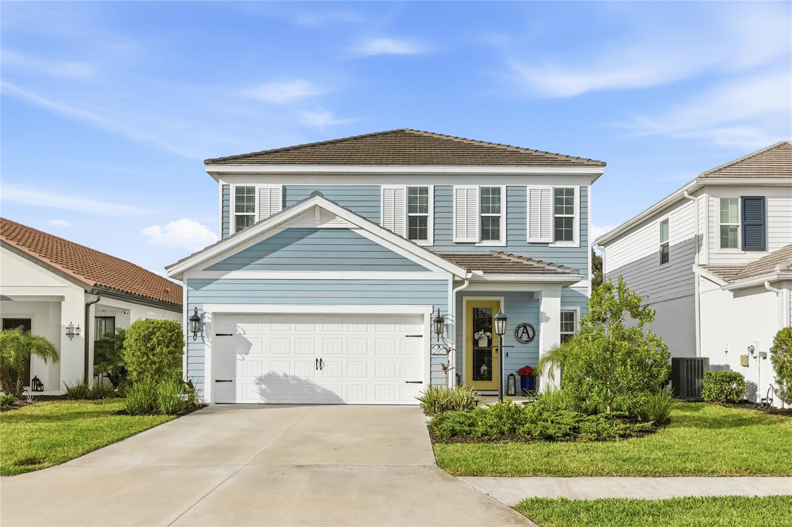 Located on a quiet cul-de-sac in the village of Indigo at Lakewood Ranch, this beautifully maintained two-story home offers over 2,400 square feet of bright, open living space with peaceful preserve views and exceptional privacy in the backyard. Built in 2023, the home welcomes you with a charming covered entry and inviting curb appeal. Inside, the thoughtfully designed floor plan features warm wood flooring throughout the main living areas, abundant natural light, and an open layout that connects the kitchen, dining area, and great room into one comfortable gathering space. The kitchen serves as the heart of the home, showcasing a large quartz island with seating, sleek white cabinetry with soft-close features, stainless steel appliances, a gas range, and a spacious walk-in pantry. Contemporary pendant lighting adds style while the open design keeps everything connected for everyday living or entertaining. The great room features a tray ceiling and large sliding glass doors that lead to the covered lanai, creating an easy transition between indoor and outdoor living. The covered patio overlooks the wide backyard and tranquil preserve setting, offering a private backdrop and plenty of space for outdoor enjoyment. The home is also pre-plumbed for a future pool and outdoor television. The first-floor primary suite provides a peaceful retreat with sliding doors that open to the lanai, a spacious walk-in closet, and an ensuite bath with dual vanities and a large walk-in shower. Upstairs, a generous loft creates a versatile bonus space ideal for a media room, game room, home office, or additional living area. Three additional bedrooms provide comfortable accommodations for family or guests. Additional features include a blue light air filtration system integrated into the HVAC system for enhanced indoor air quality. Residents of Indigo enjoy a gated community with resort-style amenities including two pools, a fitness center, pickleball courts, playgrounds, walking trails, and a full-time lifestyle director coordinating neighborhood events. Lawn maintenance and irrigation are included for easy living. Conveniently located near A-rated schools, Bob Gardner Park, shopping, dining, and everything Lakewood Ranch has to offer, this home combines modern comfort, privacy, and a welcoming neighborhood atmosphere. **THIS PROPERTY QUALIFIES FOR A 1% LENDER INCENTIVE IF USING PREFERRED LENDER. INQUIRE FOR MORE DETAILS.**