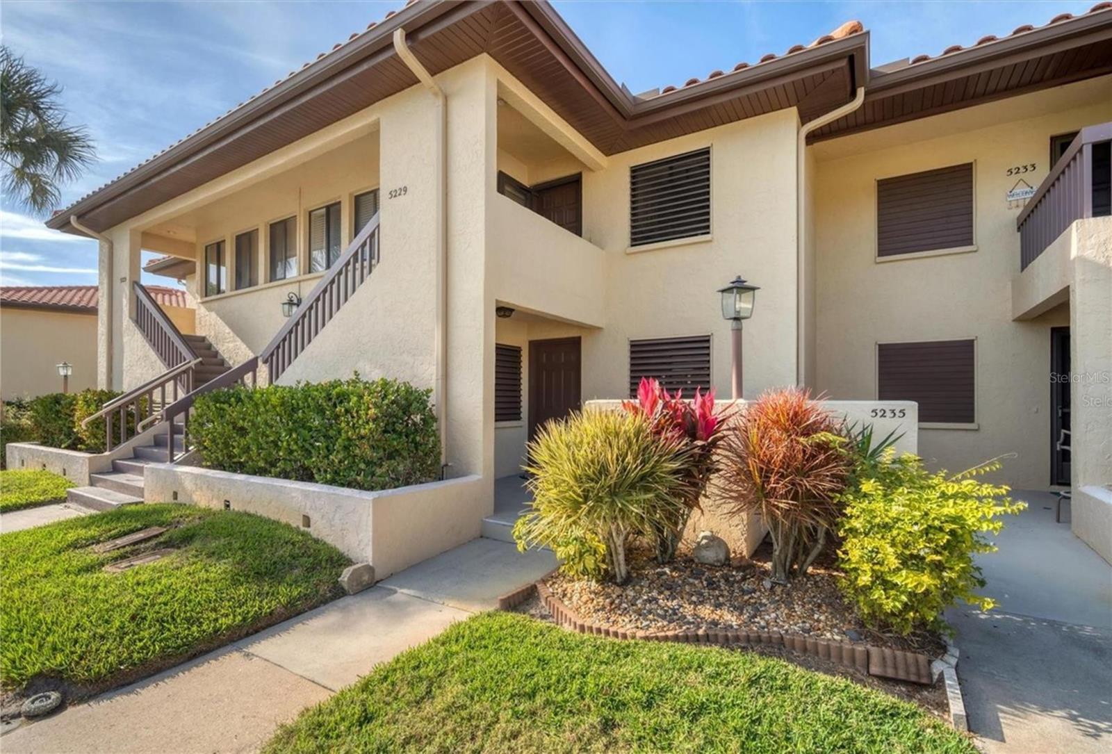 Short Sale. Experience a turnkey, lock & Leave - maintenance free lifestyle in this refined 2-bedroom, 2-bathroom, ground floor residence at 5231 Lake Village Dr, offering 1,178 sq. ft. of living space in one of Sarasota’s most established, canopy-shaded neighborhoods. Meticulously maintained and move-in ready, the interior features sophisticated updates, including crown molding and custom cabinetry, with a layout that flows into an intentional dining space and a glass-enclosed, professionally landscaped lanai, your private sanctuary for morning coffee overlooking the water. Perfectly positioned for the discerning buyer, the home offers effortless convenience at the nexus of Sarasota’s key corridors, just 10 minutes from the University Town Center (UTC) district and a direct 15-minute commute to the cultural heart of downtown Sarasota. This residence offers a rare opportunity to own in a master-planned community celebrated for its timeless charm and preserved green spaces; we invite you to contact us today to coordinate a private viewing of this lakeside gem.