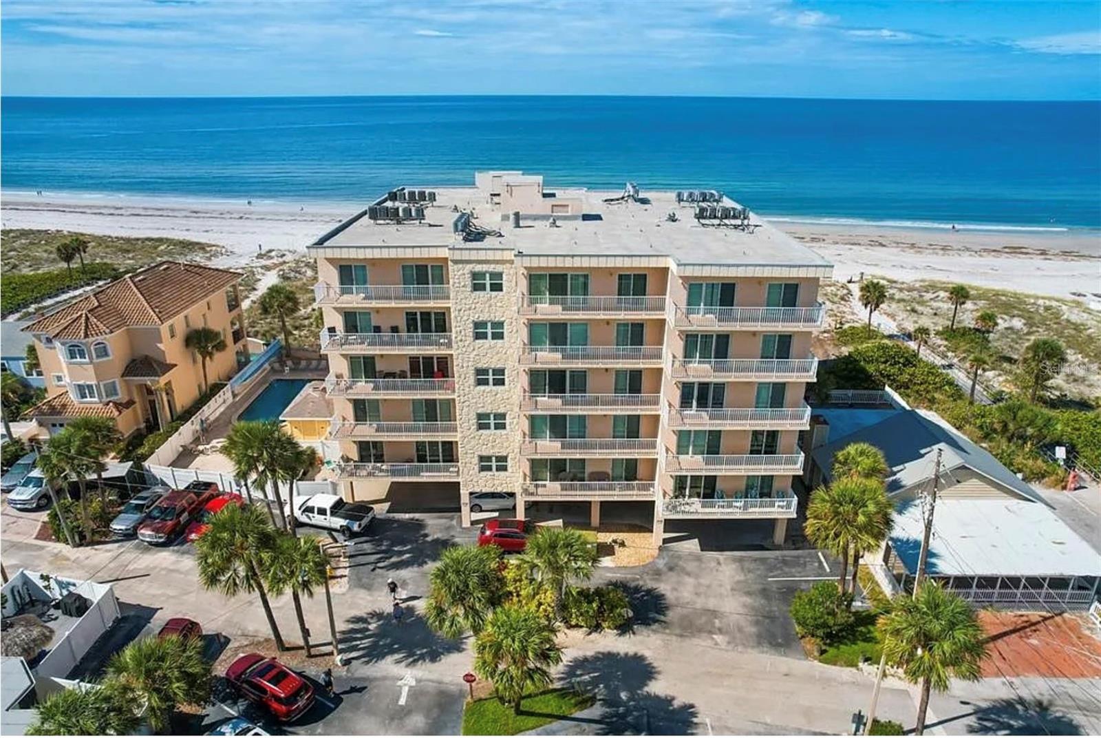 Welcome to Collwood 202, second-floor unit offering partial views of the Intracoastal Waterway and peaceful east-facing sunrises from the main living areas. Enjoy this peaceful gulf front area of Madeira Beach set back from Gulf Blvd. Fully furnished with charming coastal décor, the condo features a spacious, open layout that’s perfect for personal use (owner use is not restricted) or weekly vacation rentals. Natural light fills the unit, creating a warm and inviting atmosphere throughout. Collwood offers the ease of an on-site rental and management office, ideal for generating hassle-free rental income, self-manage or choose your own rental company.  Community amenities include a newly renovated beachfront pool with modern glass fencing for unobstructed Gulf breezes, plenty of lounge seating, a BBQ grilling area, and shuffleboard. The secure, updated lobby with coded access leads to indoor corridors, offering easy access and weather protection year-round.
