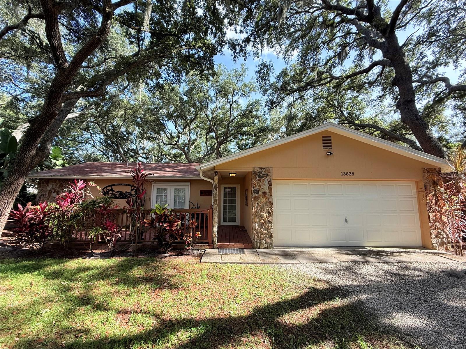Charming 3-bedroom, 2-bathroom single-family home nestled on a quiet, established street in the heart of Odessa's sought-after Starkey Ranch corridor. With 1,528 SF of comfortable living space and 2,226 SF under roof, this well-maintained home offers two spacious living areas, a cozy fireplace, and a bright open kitchen — all filled with natural light. French doors open to a welcoming front porch, and the stone accent facade gives the home timeless curb appeal. Ceiling fans throughout.

Step outside to your private backyard oasis: a screened lanai/patio, wraparound wood deck, and a fully fenced 0.26-acre lot — ideal for entertaining, pets, or simply enjoying the Florida lifestyle. The attached 2-car garage provides ample storage and parking. A brand new roof was installed in 2023, offering peace of mind for years to come.

Perfectly positioned just minutes from the Suncoast Parkway, Tampa International Airport, and an abundance of shops and dining. Zoned for top-rated Pasco County schools.