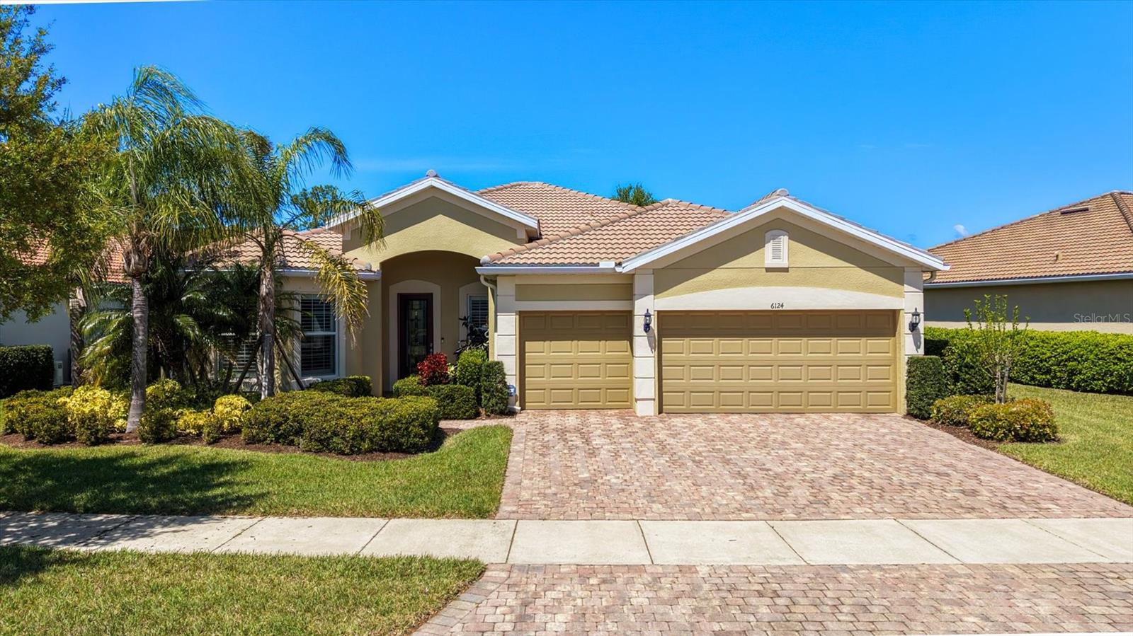Set against a beautiful waterfront backdrop, this 3 bedroom plus den "PINNACLE" floorplan offers the perfect balance of relaxed Florida living and refined design. From the moment you step inside, the open-concept layout creates a sense of space and flow, ideal for both quiet evenings at home and lively gatherings. At the center of the home, a dream kitchen impresses with abundant counter space, ample storage and a generous island that invites both casual dining and conversation. The living space opens effortlessly to to the outdoor area, where a large swimming pool with waterfall feature invites you to unwind. The flexible den provides the perfect space for a home office or guest accommodations - while the 3 car garage offers exceptional storage and convenience. Beyond the home, a vibrant, ACTIVE, amenity center brings neighbors together with a social director offering a variety of social opportunities, creating a true sense of community. The Isles of Sarasota is a true gem with a beautiful clubhouse, fitness center, 4 Har Tru tennis courts, pickle ball, basketball courts, a playground, and a resort-style pool. Conveniently located near world-renown Siesta Key Beaches, dining, golf, I-75 and the Sarasota Square Mall redevelopment. Furnishings available.