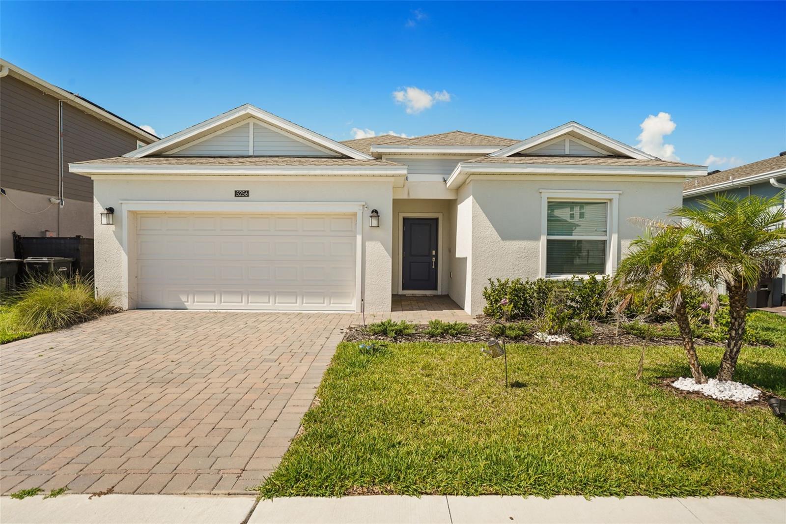 Welcome to 5256 Dagenham Drive, located in the highly sought-after Providence Golf & Country Club, a 24-hour manned gated community in Davenport. This beautifully maintained 4-bedroom, 2-bathroom home offers an open-concept floor plan designed for both everyday living and entertaining.

The spacious kitchen overlooks the dining and living areas, creating a seamless flow throughout the heart of the home. The private primary suite features dual walk-in closets and an ensuite bathroom with dual vanities, providing comfort and functionality. Three additional bedrooms allow flexibility for family, guests, or a home office.

Step outside to the covered screened in lanai and enjoy peaceful outdoor living with room to relax, dine, or entertain. The home also includes a two-car garage and energy-efficient features throughout.

Residents of Providence enjoy access to exceptional resort-style amenities, including a clubhouse restaurant, fitness center, resort-style pool, lap pool, tennis courts, playgrounds, dog park, walking trails, and more. Conveniently located near major highways, shopping, dining, and Central Florida's world-famous attractions, this home offers the perfect combination of luxury, convenience, and an active lifestyle.

Schedule your private showing today and discover why Providence continues to be one of Central Florida's premier golf course communities.