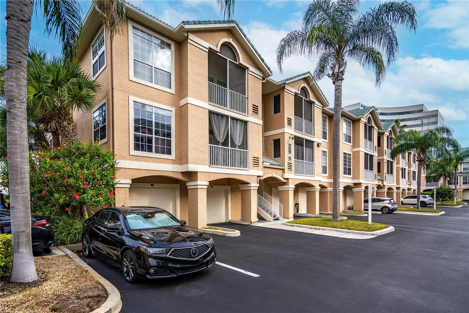 Welcome home to beautiful Island Club at Rocky Point, a serene, gated, waterfront community on Old Tampa Bay! This light-filled and spacious, second-story condo with an open and airy feel creating the perfect place to call home. Featuring an oversized garage with secure interior access, providing exceptional convenience, functionality, and easy access to your home. Residents enjoy resort-style waterfront amenities including a heated saltwater pool, jacuzzi, sauna, outdoor showers, grilling area, fitness center, clubhouse, and a private community pier - perfect for launching your kayak, fishing, or simply taking in the peaceful bay views. Ideally located, this community is just a short walk to restaurants, bars, biking and walking paths, and only minutes to Tampa International Airport, International Mall, Raymond James Stadium, the sugary sand of Clearwater Beach, and major highways for easy commuting. The HOA fee includes premium internet and cable service, security gate, flood insurance, roof and exterior maintenance, pest control, car wash and vacuum area, grounds maintenance, property management, escrow reserves, and full access to the community's high-end amenities. Schedule your private showing today and experience resort-style waterfront living at Island Club at Rocky Point.