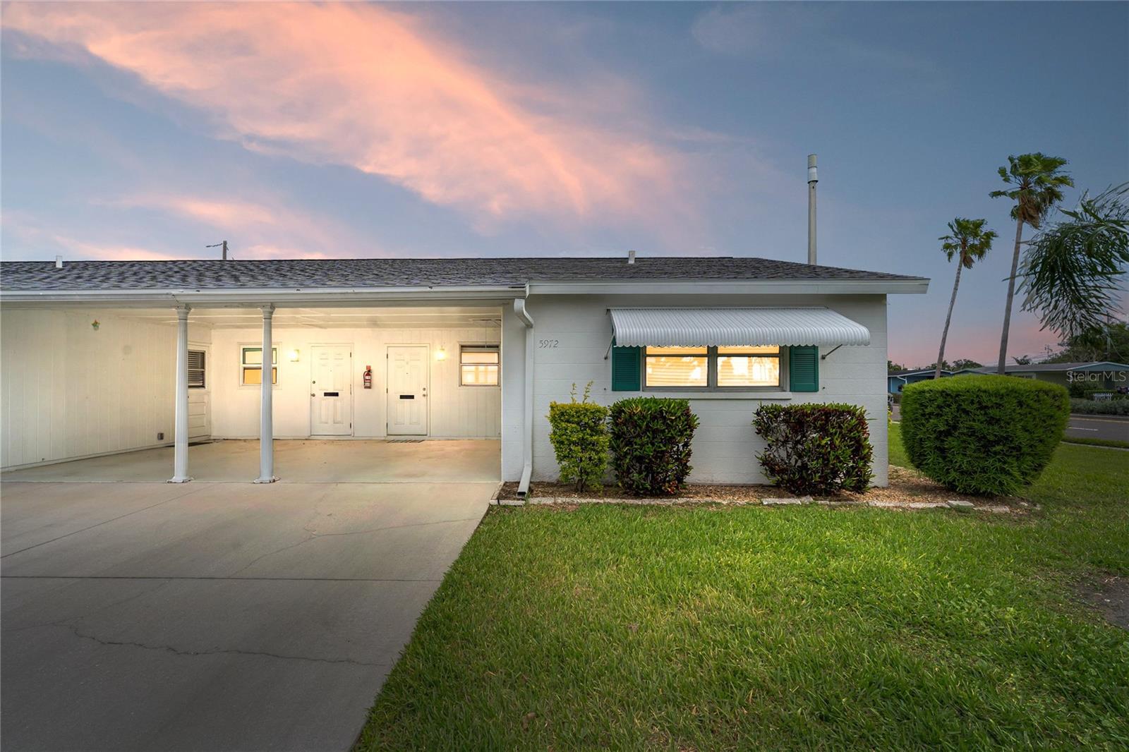 Back on the market—no fault of the seller! Discover maintenance-free living in the sought-after 55+ community of Parkway Villas. This move-in-ready 2-bedroom, 1-bath end-unit condo features wood laminate flooring throughout, granite countertops, a walk-in tiled shower, and a spacious tiled lanai perfect for enjoying Florida sunsets. Enjoy peace of mind with major updates including a new roof and HVAC (2025), plus recent improvements in 2026. The attached carport and ground-floor location add everyday convenience. Parkway Villas offers an active lifestyle with a heated pool, clubhouse, shuffleboard, billiards, fitness activities, social events, and more. Ideally located near Gulf beaches, shopping, dining, golf, and airports, this is the perfect place to enjoy everything Florida has to offer. Schedule your showing today!