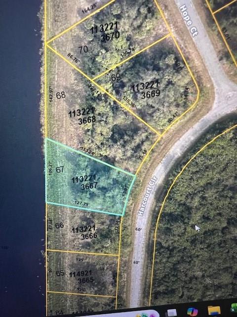 Lot 67 of Harcourt Cir Features "Water front View," Beautiful Water View for you and your family to enjoy! Completely ready and buildable. 
Excellent opportunity to own vacant land in North Port, one of Southwest Florida’s fastest-growing areas. New construction single family homes happening in this area. Exciting News? No HOA or Deed Restrictions! Property is within a short drive of shopping, dining, schools, and healthcare facilities. Quick access to I-75 makes commuting north to Sarasota or south to Fort Myers convenient, close to Gulf Coast beaches, parks, and recreational activities. Whether you plan to build now or secure land for future use, this lot offers both potential and value in one of Florida's fastest-growing communities. Don't wait and seize this opportunity to own a waterfront property in Florida's most popular area. Call me!