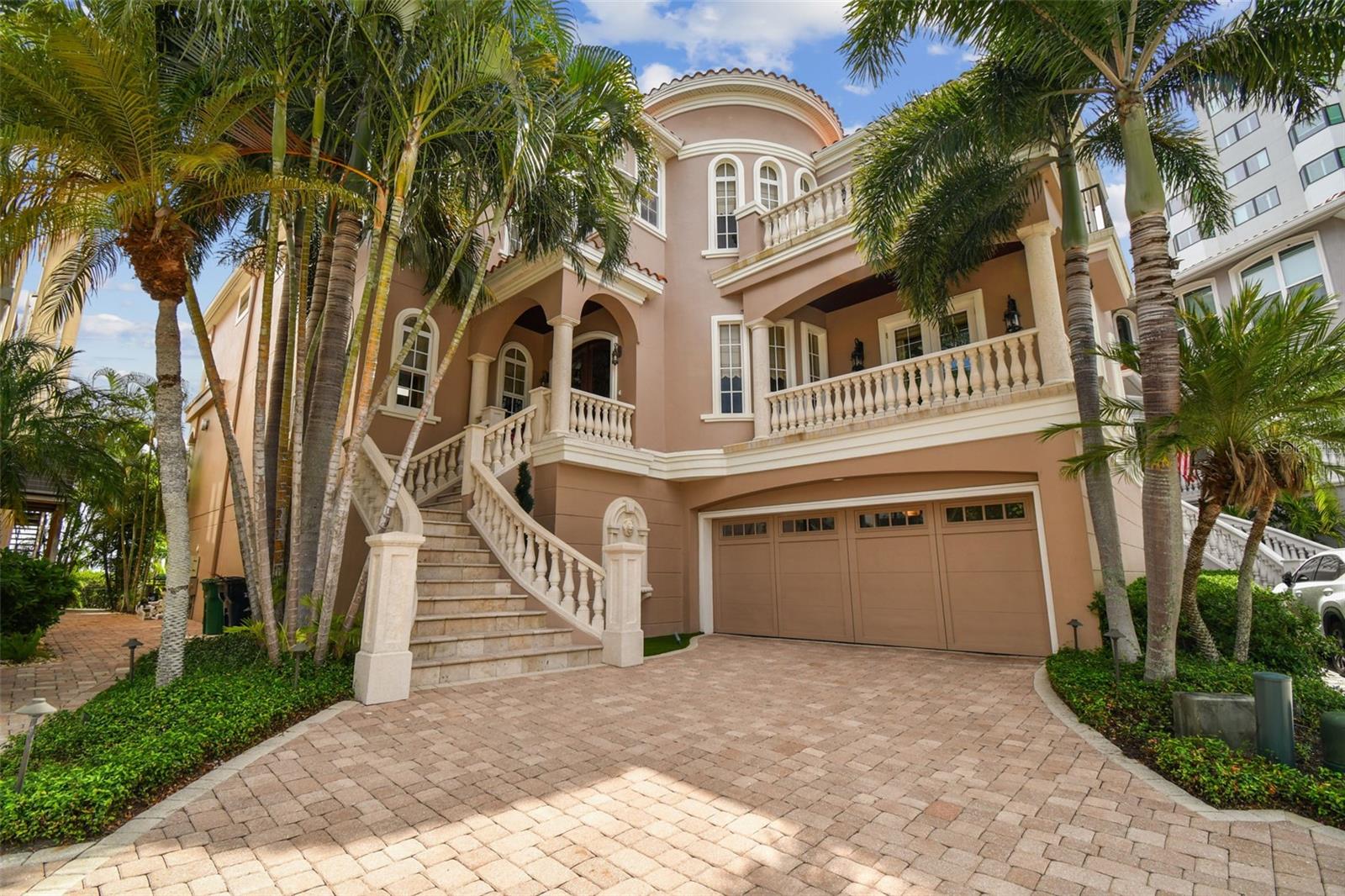 Very rare opportunity to live on Bayshore Blvd in a meticulously maintained
home, in a secure and private gated community of ten luxury homes! This pool
home that is truly OPEN Bay with some of the most majestic views in all of
Tampa.  This small enclave is situated right at the end of one of the longest
continual sidewalks in the world right where Gandy and Bayshore Blvd
meet. This home was custom built by Alvarez Homes for the current owner
with extreme attention to detail and ultra-high quality finishes and upgrades
throughout while being constructed HIGH and DRY with the entire ground floor
being a garage and an enormous amount of storage space. Step into the
home and the rounded foyer is a work of art with a gorgeous curved floating
staircase. Take a look to your left and your eye is immediately drawn to the
shimmering blue from the open water views off the back balcony.  On this floor
there is a lovely formal dining area which opens to the family room with
soaring 20+ foot ceilings and beautiful custom built-ins and a gas fireplace. 
The kitchen is large and inviting with a double island and a dining nook with
windows overlooking the water, gorgeous solid wood custom cabinetry, double
oven, built-in paneled refrigerator, induction range (also wired for gas),
microwave drawer, and an ice maker. Situated directly off of the family room is
a large lanai with endless views plus an outdoor kitchen with a 36 inch
Alfresco Grill, sink, and refrigerator and a spiral staircase taking you to the
inviting pool area and dock. Also on this floor is the laundry room and a guest
suite with its own private balcony.  Head up the stairs to the 3rd floor or take
the ELEVATOR to the 2nd guest suite, a beautifully built out library/office/den,
again with fabulous views of the bay. Then, move on to the enormous and
inviting Master Suite, with sitting area adorned by a gas fire place, large
covered balcony, and amazing views of the bay. The large and open Master
Bath has a walk-in shower with steamer, separate garden tub, and closet with
custom built-in hardwood cabinetry, and its own washer and dryer. A truly
stunning home!