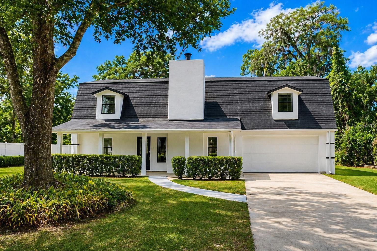 Recently renovated and move-in ready, this stylish 4-bedroom, 3-bath home offers 2,028 sq ft of comfortable living space in the Lake Bosse Oaks community. Inside, you are welcomed by a bright, open-concept layout with soaring ceilings, recessed lighting, and oversized tile flooring throughout the main living areas. The spacious living and dining areas flow seamlessly into an updated kitchen designed for both style and functionality. Additional features include smart lighting, a smart thermostat, and an electric fireplace that adds warmth and character. Situated on a generous lot with mature trees, this home offers privacy, charm, and convenience in a desirable Orlando location. A great combination of comfort, updates, and curb appeal—ready for its next owner to enjoy. All information, including room sizes, square footage, property features, and photos, is deemed reliable but is not guaranteed and should be independently verified by Buyer and/or Buyer’s Agent. Photos include AI-generated or virtually staged content for visual concept purposes.
