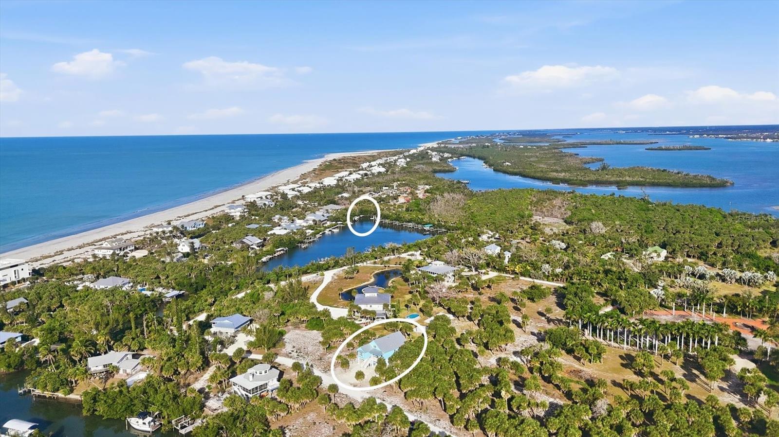 Charming coastal cottage on "Palm Island"...newly built in 2024, offers the perfect blend of island charm, modern construction, and waterfront access with a deeded dock providing direct access to the Intracoastal Waterway and Gulf of Mexico — a boater’s dream.

Designed for both beauty and durability, this home features cement board-and-batten siding, composite decking, hurricane impact windows and doors, and a metal roof, delivering peace of mind along with undeniable curb appeal. Inside, coastal finishes and breezy décor create true “vacation vibes” with 3 bedrooms, 2.5 baths, and a thoughtfully designed layout that feels relaxed yet refined.

Enjoy morning coffee and evening cocktails on both the front and back porches, where gentle island breezes and the sounds of nature set the tone for daily life. Whether you’re entertaining guests or savoring quiet moments, this home is perfectly suited for laid-back coastal living.

Life on Palm Island is unlike anywhere else — explore by golf cart, kayak through pristine waterways, cast a line in some of Southwest Florida’s best fishing spots, stroll uncrowded beaches filled with shells and sharks’ teeth, and cap each day with breathtaking sunsets over the Gulf.