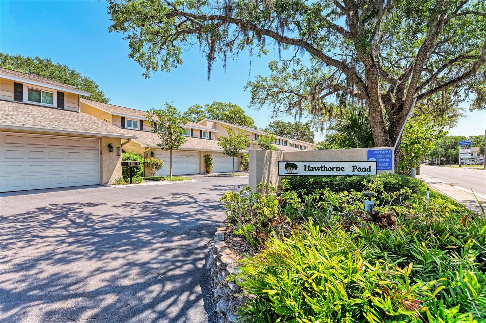 Welcome to South Tampa’s Hawthorn Pond, a small enclave of town-homes located on a natural spring-fed pond. Incredible opportunity to sign an annual lease for the new year.  This two story 1833 sq ft two story 3 br, 2 1/2 bath town-home  has an oversized  2 car garage and large brick patio for entertaining. Enjoy peace and serenity from your large brick patio bordered by privacy walls and boardwalk overlooking a crystal clear pond with fish, birds, turtle and wildlife. The views of the ponds fountain and clear waters’ are abound from large picture windows with plantation shutters in living, dining, and master bedroom. You'll enjoy strolling on the boardwalk which meanders along the entire pond & property, including bridges that take you to the Banyan Tree Island. And, this location is a close proximity to Bayshore Blvd with sidewalks leading from Gandy Blvd to Bayshore Blvd. Features include new wood floors throughout upstairs bedrooms and downstairs living areas, wood burning stone fireplace, new impact windows, new Plantation Shutters, and fresh paint throughout. The kitchen has brand-new stainless-steel appliances and a separate kitchen dining area. Upstairs, the master suite offers serene views on the pond side, w/new custom cabinets in the master bath & quartz vanity, separated from the additional 2 bedrooms & hall bath. Storage is abundant, storage under the stairs, walk-in closets, linen closet, and custom cabinets in the garage with work counter. Tenant responsible for Hawthorn Pond association application fee $50 per adult, with 7 day turn around, and credit check $60 per adult, renters insurance, electric, & internet. Minimum 680 credit score, min 50% debt ratio, and no subleasing.