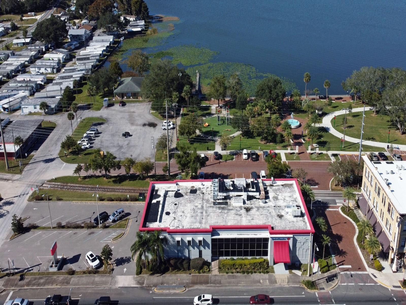 Opportunity knocks in the heart of Eustis! A spacious bank building is available for sale, and it's perfect for multiple tenants. With an elevator and two sets of stairs to the second floor, this property offers convenience at every turn. It boasts a large conference room, private bathrooms, and ample office spaces with workstations. Large windows provide stunning views of downtown Eustis, Ferran Park, and Lake Eustis, creating an inspiring work environment. The building has been well-maintained and even has brand new AC units installed in 2022! Access is easy, with four ground-floor entrances and 17 on-site parking spaces. Plus, there's ample public parking at the rear of the building. Imagine your business thriving in the center of Florida, with Orlando just a stone's throw away. The new beltway makes it a breeze to get to OIA. Don't miss out on this amazing opportunity!