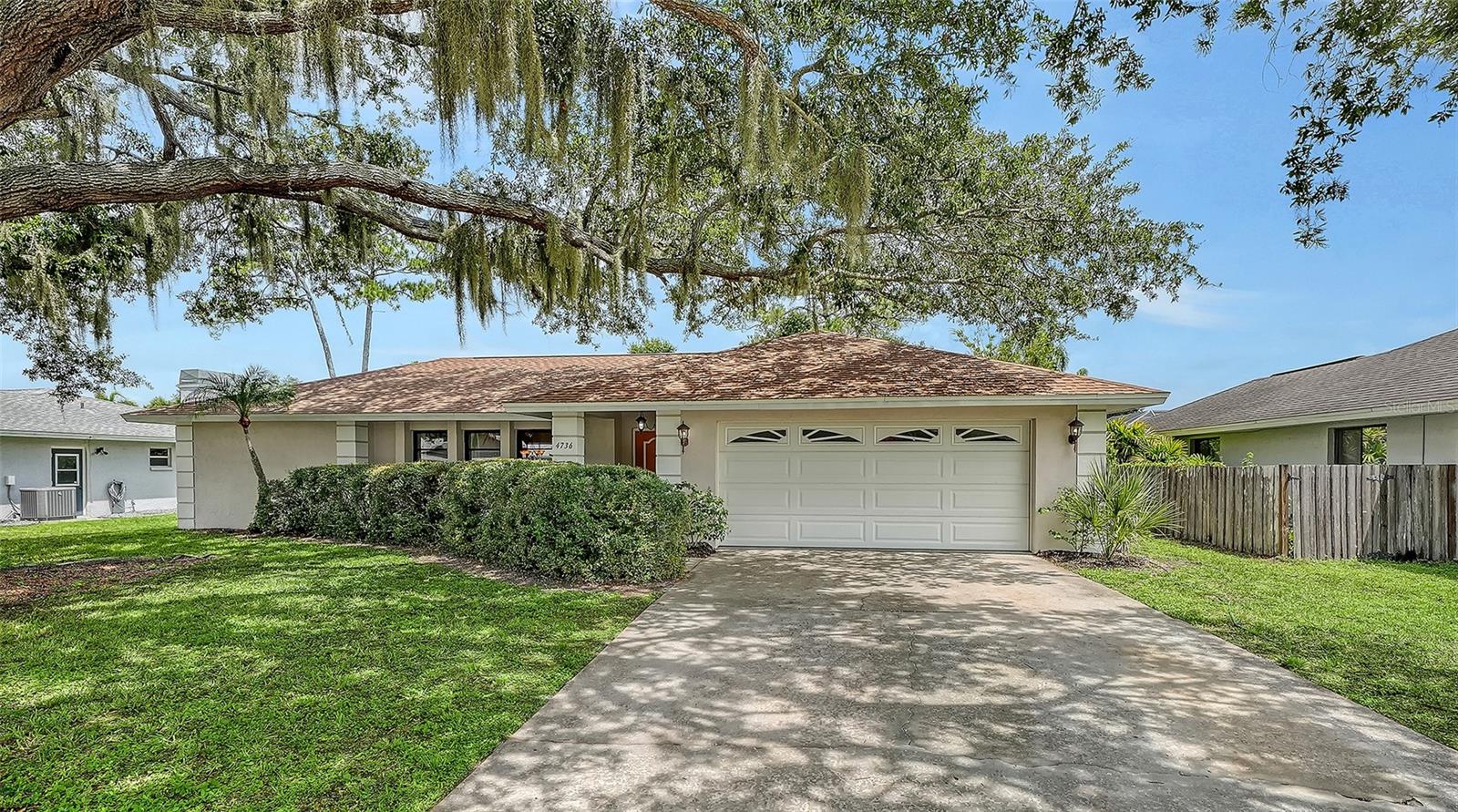 Tucked deep within the quiet winding streets of Bent Tree Village, this classic Florida home features a 3-year-old roof and a private freeform swimming pool on a large, serene lot where mature trees, native birds, and deer returning with their fawns create a nature preserve atmosphere. The intuitive split floor plan features soaring high ceilings, outstanding architectural flow, and an open feel that makes the home feel significantly larger than its footprint, offering both formal living and a large family rooms, a separate dining room, and bedrooms with generous closets. The efficient galley kitchen features a new trayed ceiling, lights and a sliding pass-through window framing fantastic views of the lush backyard, making outdoor serving to the extended covered dining area seamless. Complete with an oversized 23-foot-deep 2-car garage and kept in its stylistically original 1979 state, this home presents a rare blank canvas to design to your exact taste without paying for—or undoing—someone else’s recent remodel.